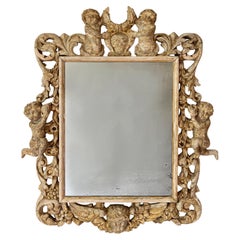 An English Charles II Style Carved Wood Mirror An English Charles II Style Carved Wood Mirror