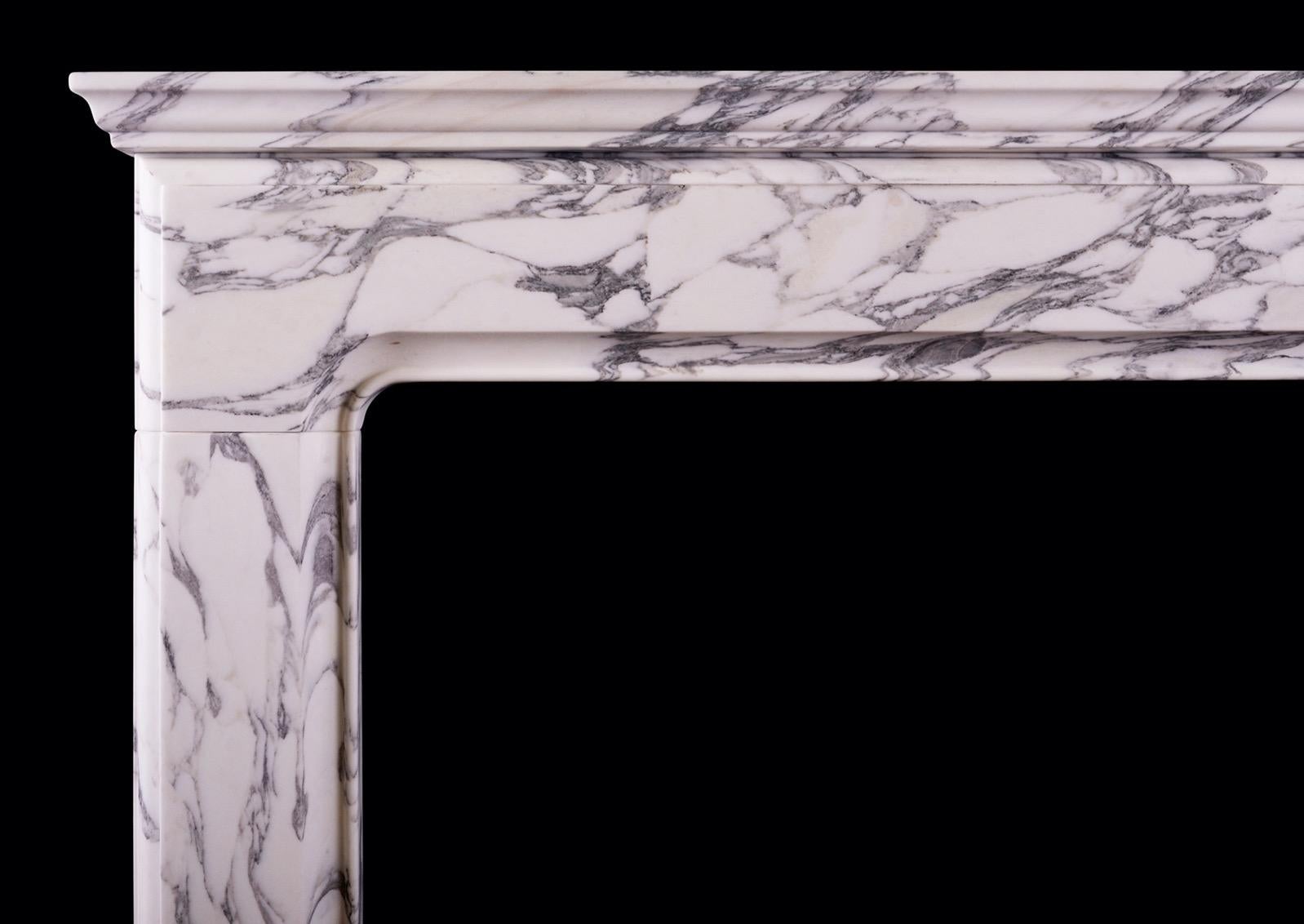 A small English bolection fireplace of architectural form. The moulded frieze and jambs surmounted by shelf above. Fine quality Italian Arabescato marble. Modern. N.B. May be subject to an extended lead time, please enquire for more information.