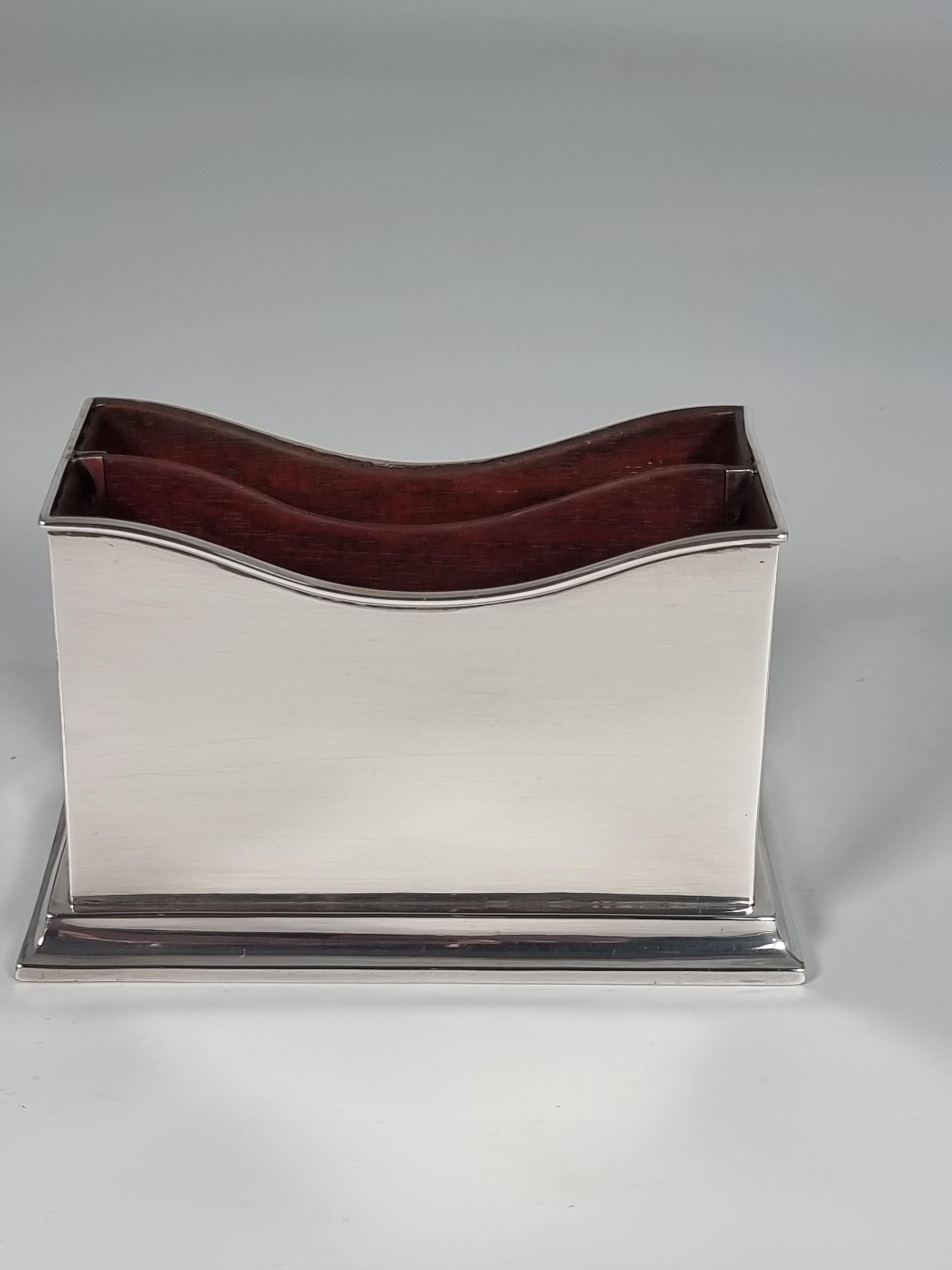 A rare late Victorian hallmarked silver postal letter rack or desk tidy which would be ideal for business cards etc.

This fine English solid silver postal letter rack is fully lined in mahogany and has a maroon leather covered base and
