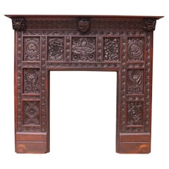 Antique English Jacobean Revival Carved Oak Fireplace