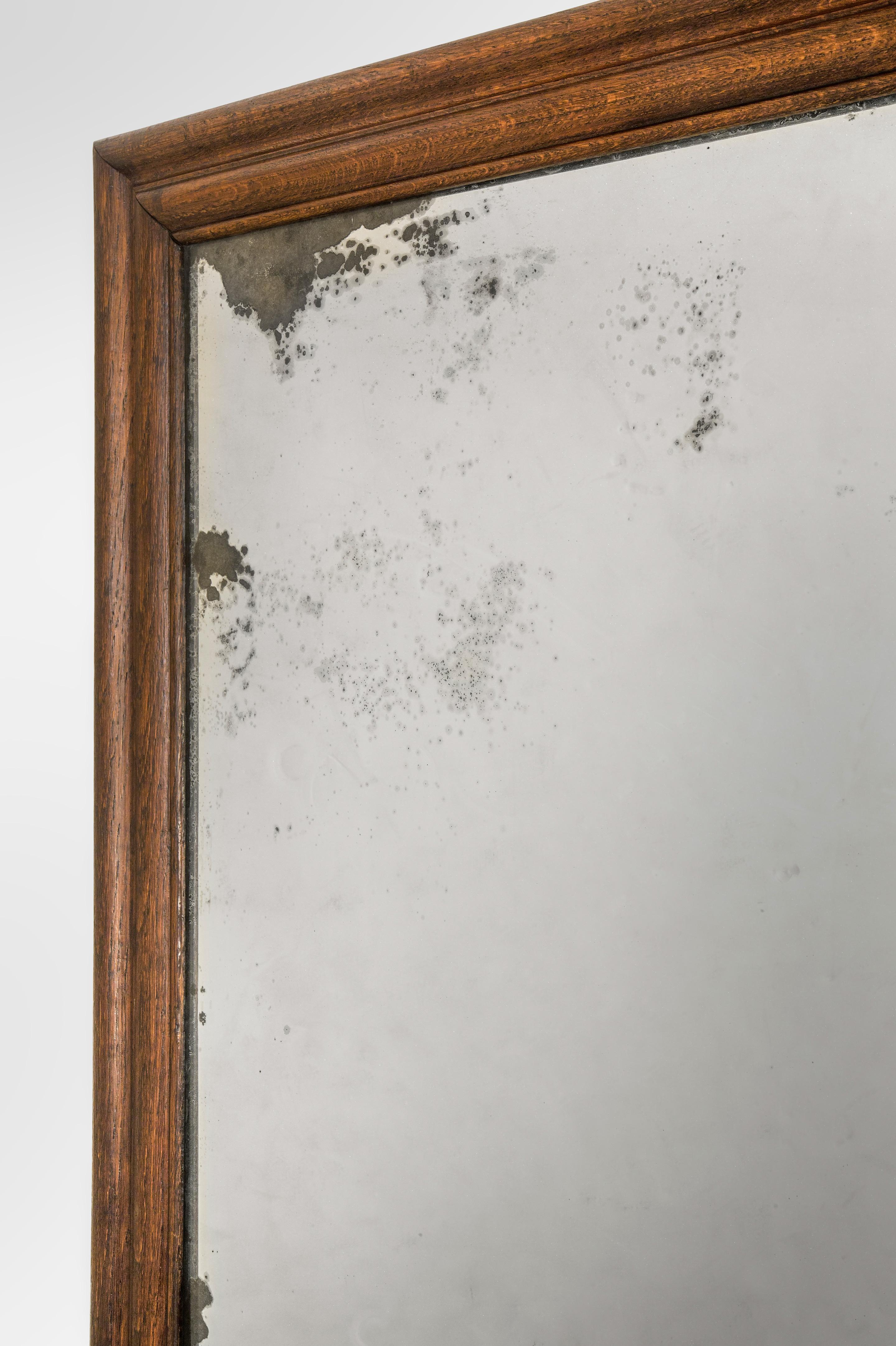 An English Large Oak Framed Mirror with Antique Glass
19th century
This unusually large mirror features a lovely period mirror glass that has the magical sparkle only achieved by glass that is more than century old. The beautifully aged mirror