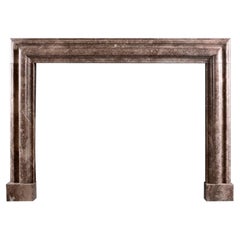 An English Marble Bolection Fireplace