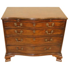 Mid-18th Century Serpentine Mahogany Chest of Drawers with brushing slide, 1760