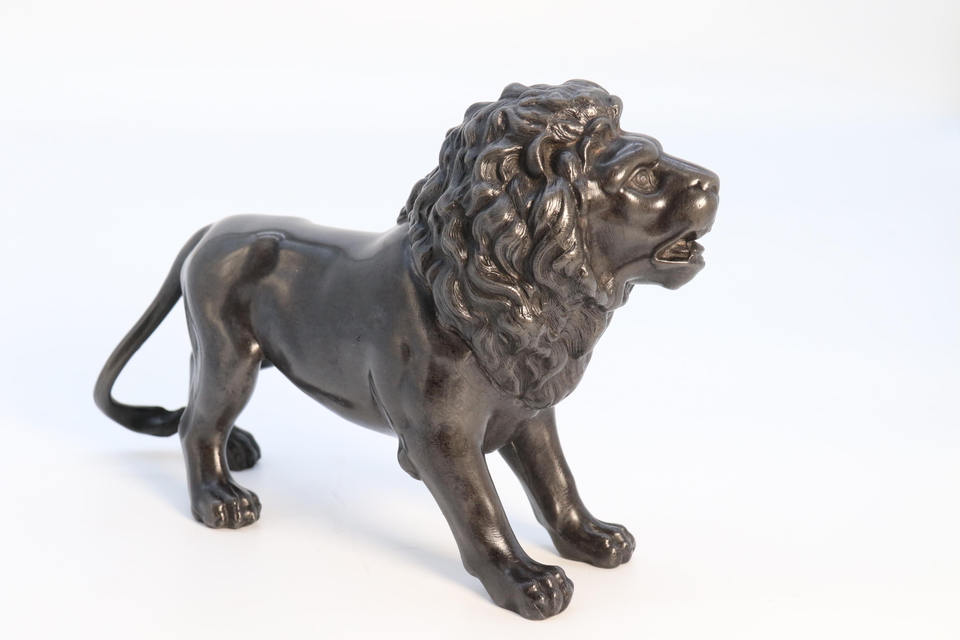 
This rare English pewter study depicts a muscular and handsome male lion. It has been produced with good scale and proportion and is well detailed, particularly to the head, mane and paws. The pewter has a pleasing dark colour with nice patination