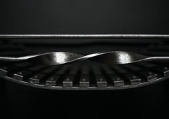 An English Polished Wrought Iron Firegrate