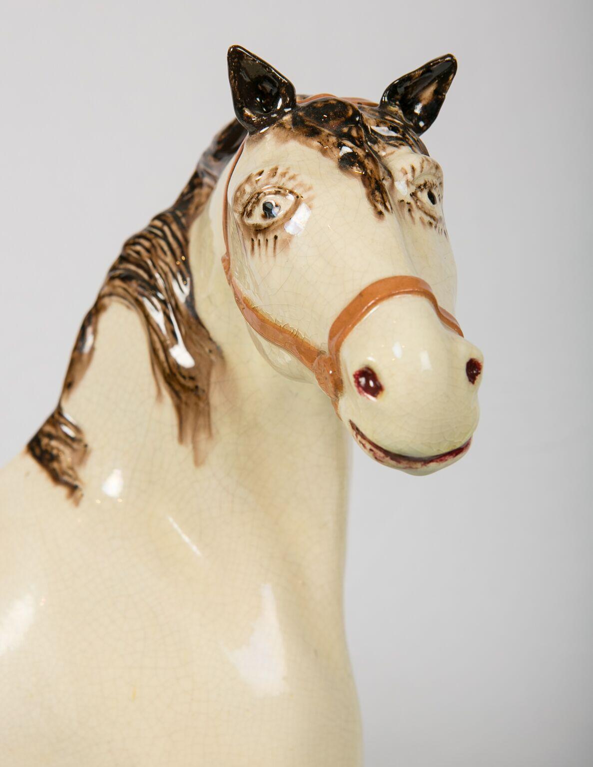  I have always wanted one of these. I'm thrilled to have found it.
This Leeds Pottery stallion has a wonderful face with beautiful eyes. 
Large creamware enamel-painted horses are rare. Leeds made the largest of the creamware horses. Our horse is