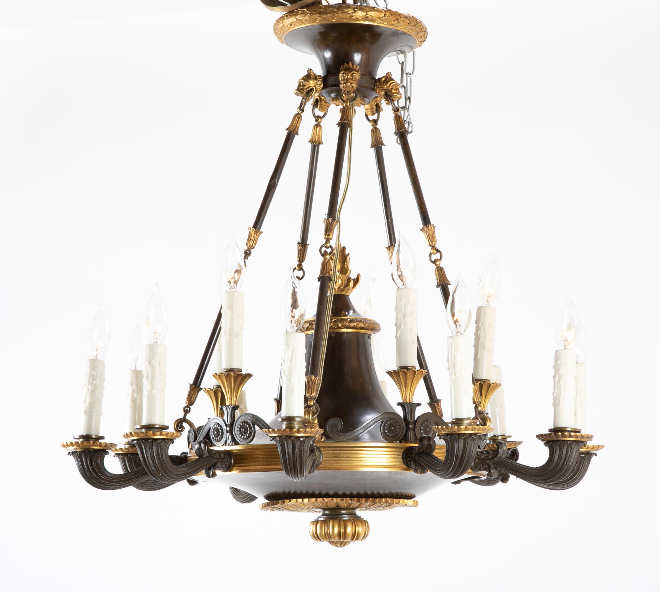 An English Regency patinated and gilt bronze 15 light chandelier from the first quarter of the 19th century.

 