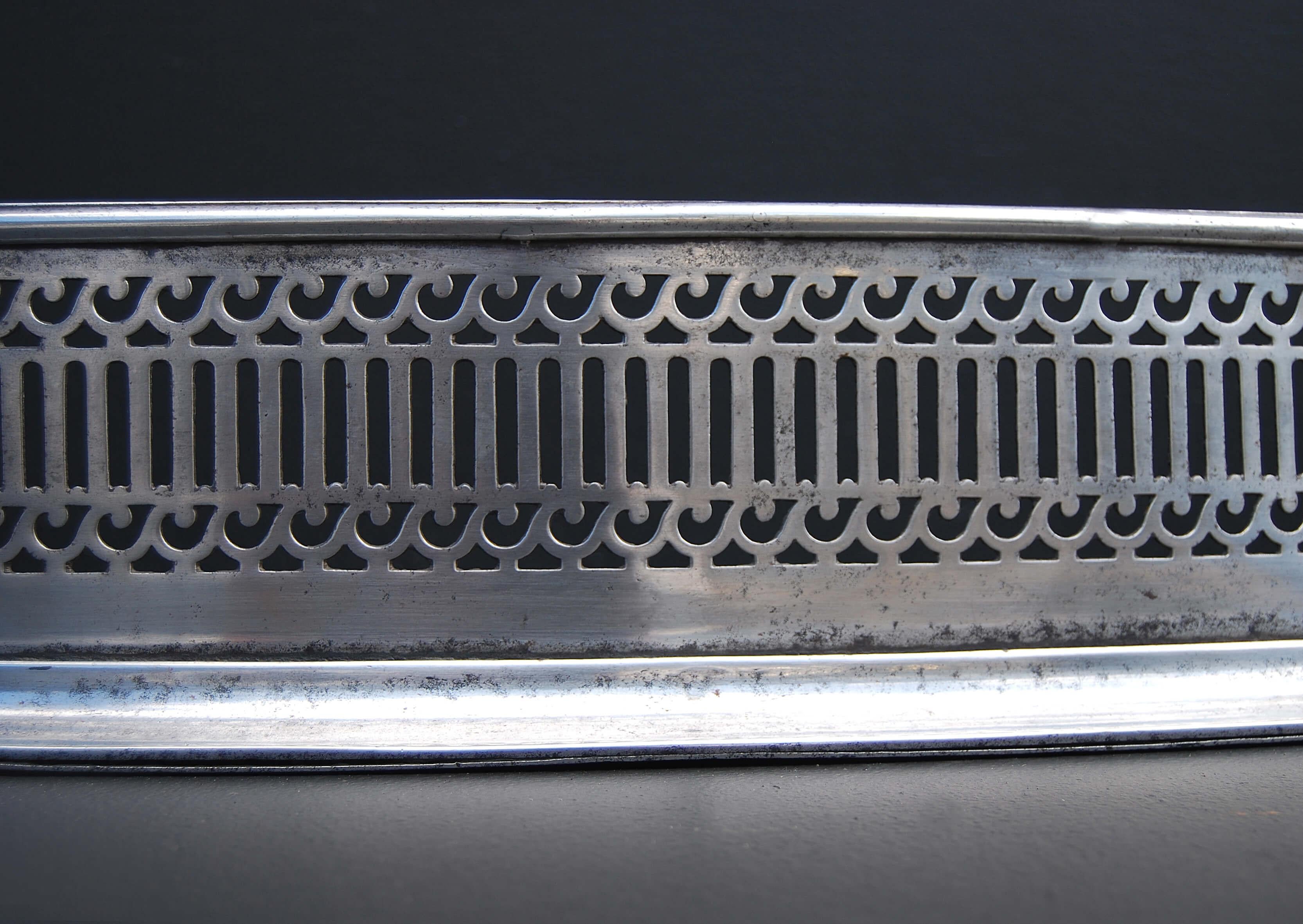 An elegant Georgian style steel serpentine fender with scrolled and fluted fretwork. 19th century.

External Width:	1395 mm      	54 ⅞