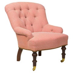 An English Tufted Upholstered and Mahogany Armchair