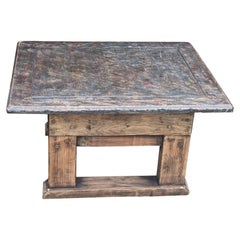 An English coffee or low table made in a rustic style, circa 1910