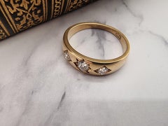 An English Victorian heavy 18ct gold and diamond three stone ring dated 1870