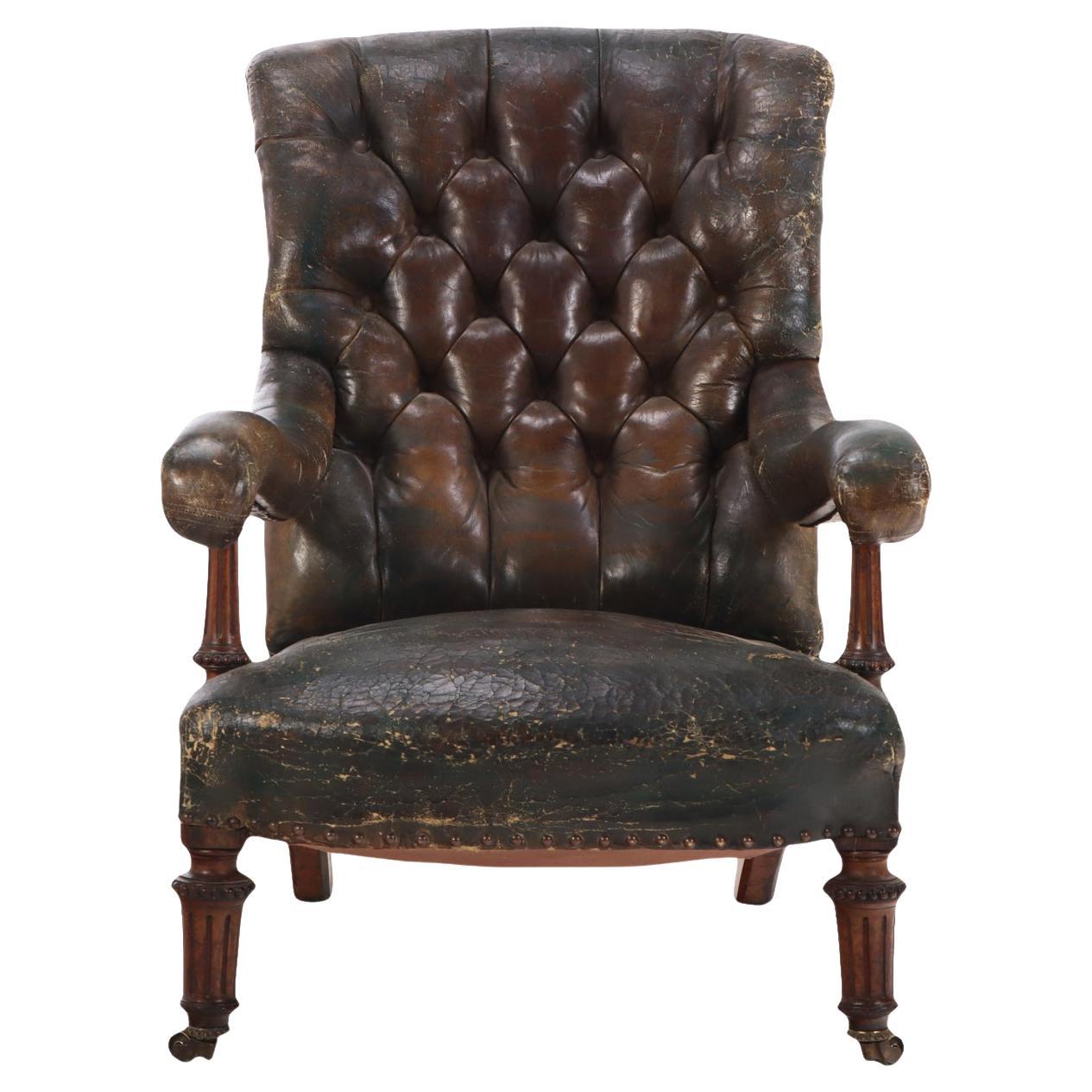 An English Walnut and Tufted Leather Library Armchair by Gillows, 19th C. For Sale