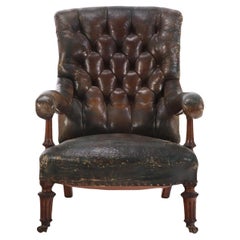 An English Walnut and Tufted Leather Library Armchair by Gillows, 19th C.