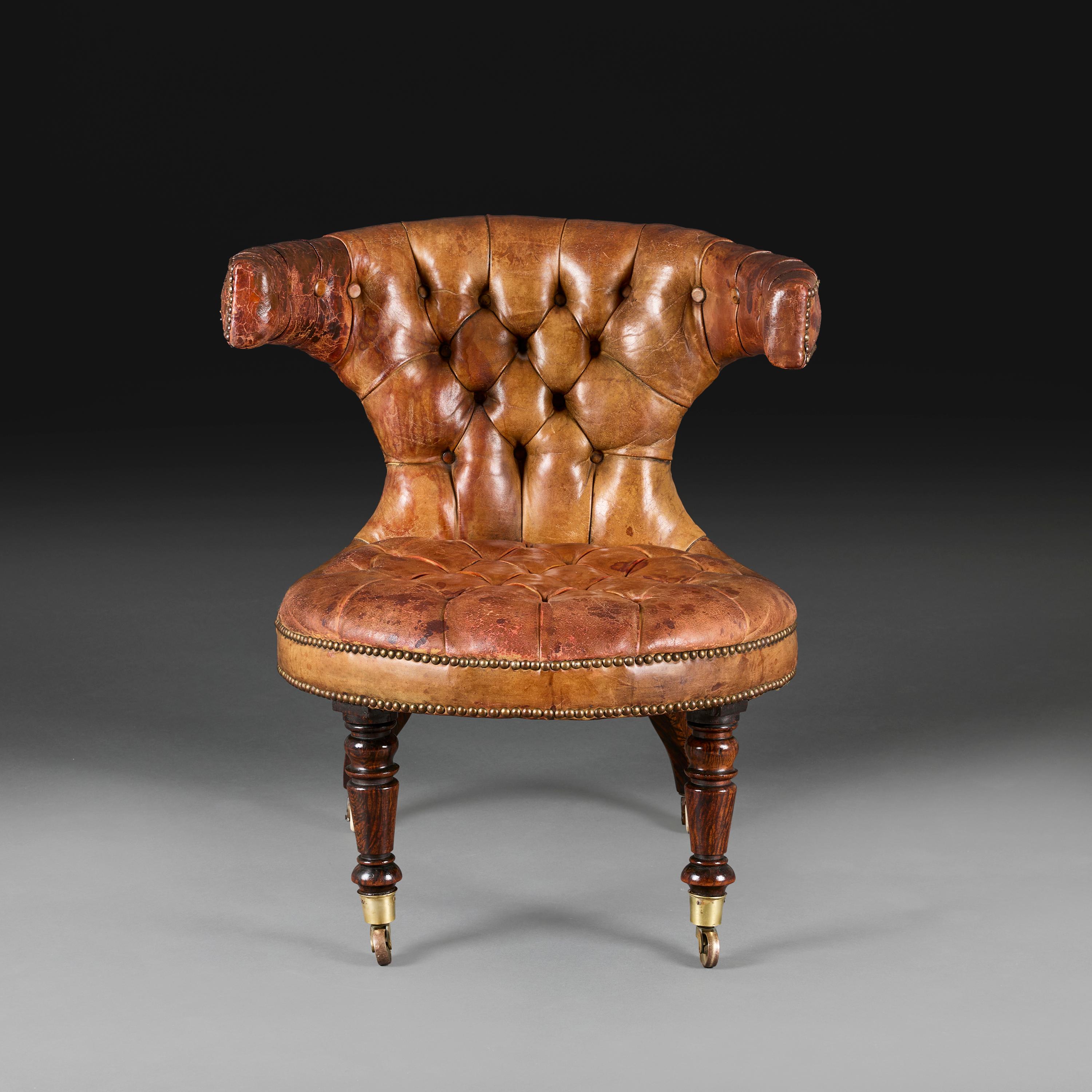 England, circa 1840

A William IV leather library chair with curved back and circular seat, with buttoned seat and back, all supported on turned baluster legs terminating in brass castors.

Height           76.00cm

Seat height  41.00cm

Total width