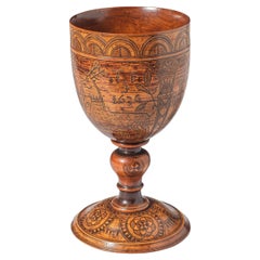 An Engraved Turned Wooden Cup. English, dated 1636.