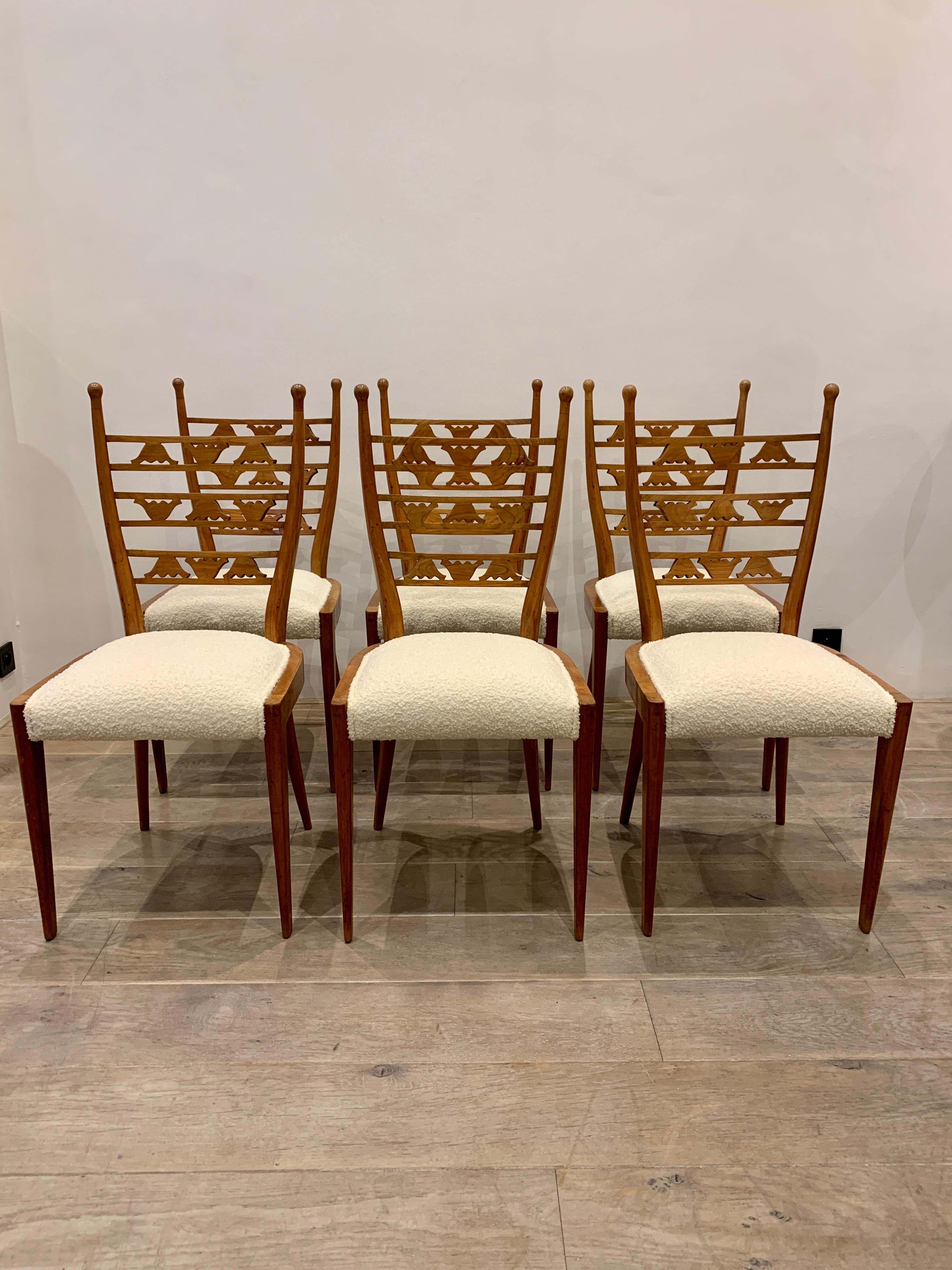 The chairs with their decorative high back are very elegant. They are clearly in the style of the Great Italian designer Paolo Buffa. Buffa created some decorative chairs with emphasis on the back where he would creates particular decorative designs