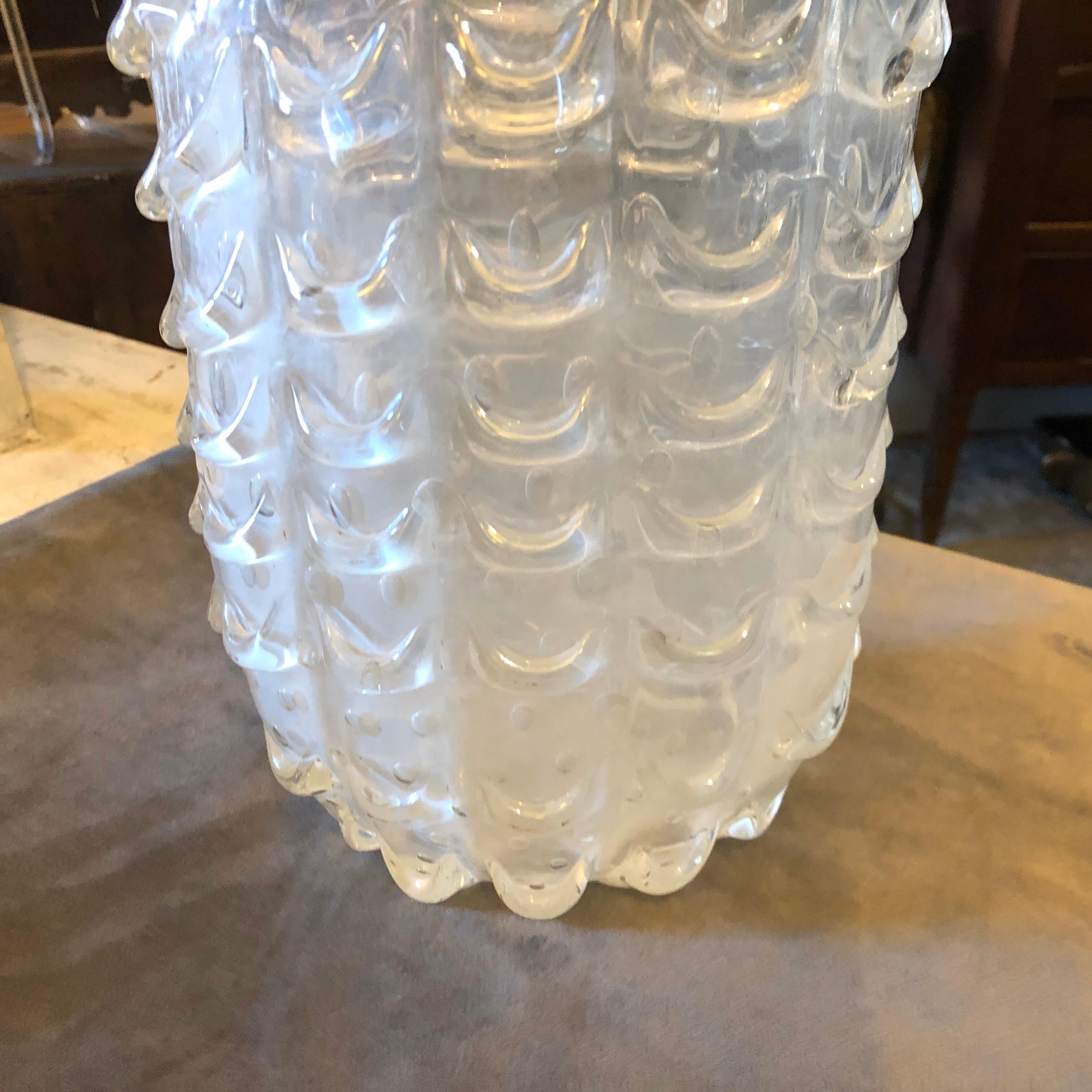 An handcrafted Mid-Century Modern Murano glass vase by Ercole Barovier. Glass is translucent and iridescent.