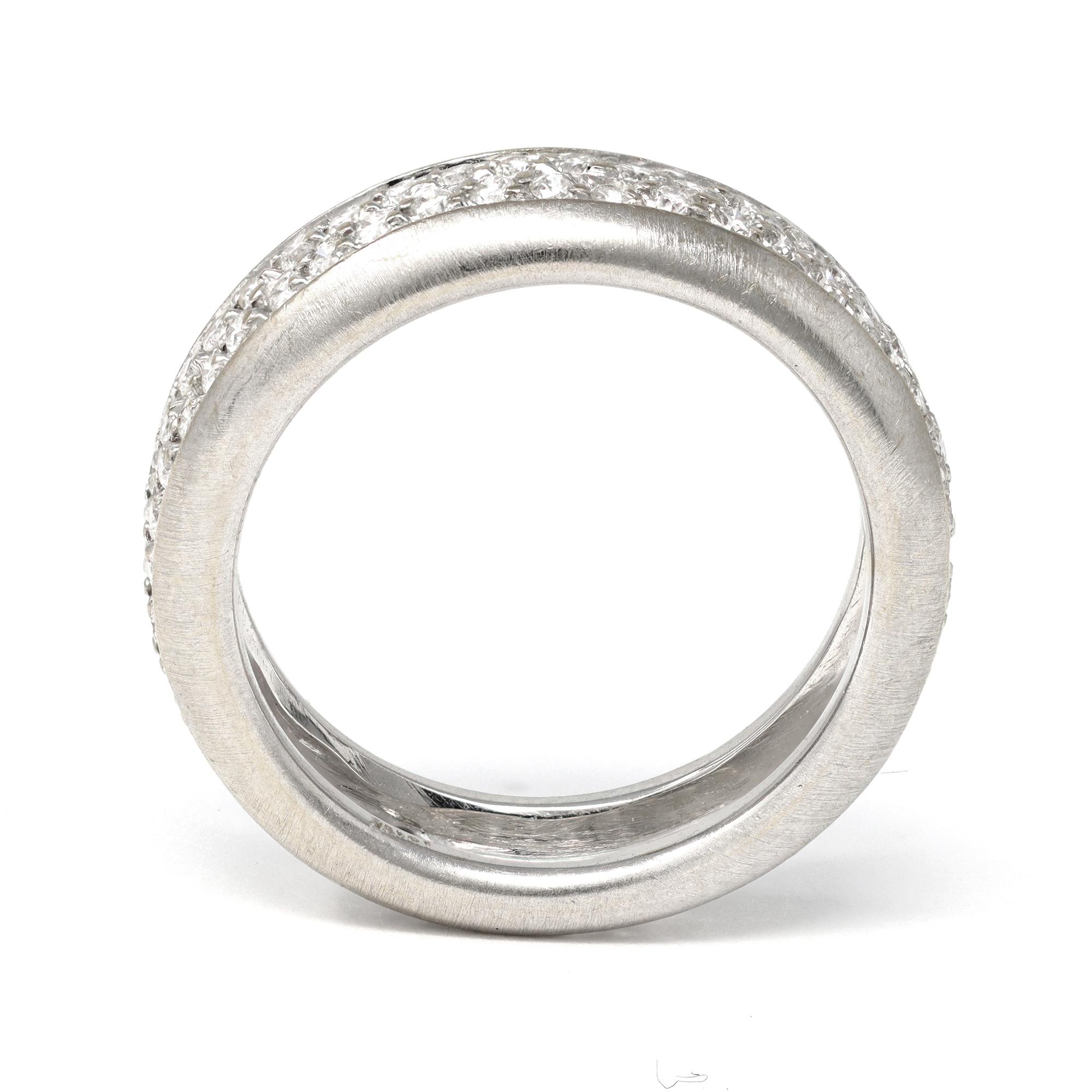An eternity pavé  diamond band ring circa 1980, set in 18K white gold with a fine brush mat finish, Circa 1980. This modern ring features pavé round diamonds with an estimated weight of 0.70 carats, G color and VS clarity. The band will fit a size 6