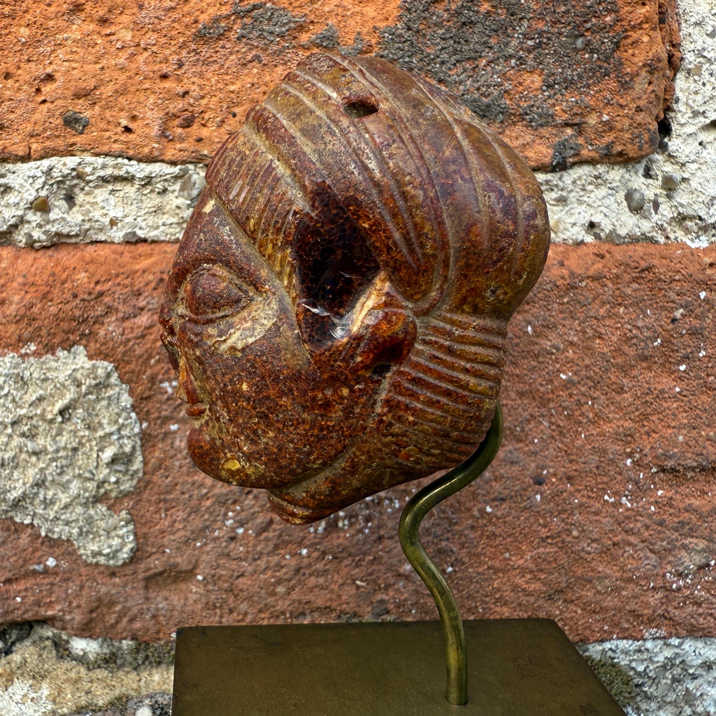 An Etruscan Amber Head Pendant. Etruria, circa 5th century B.C. For Sale 6