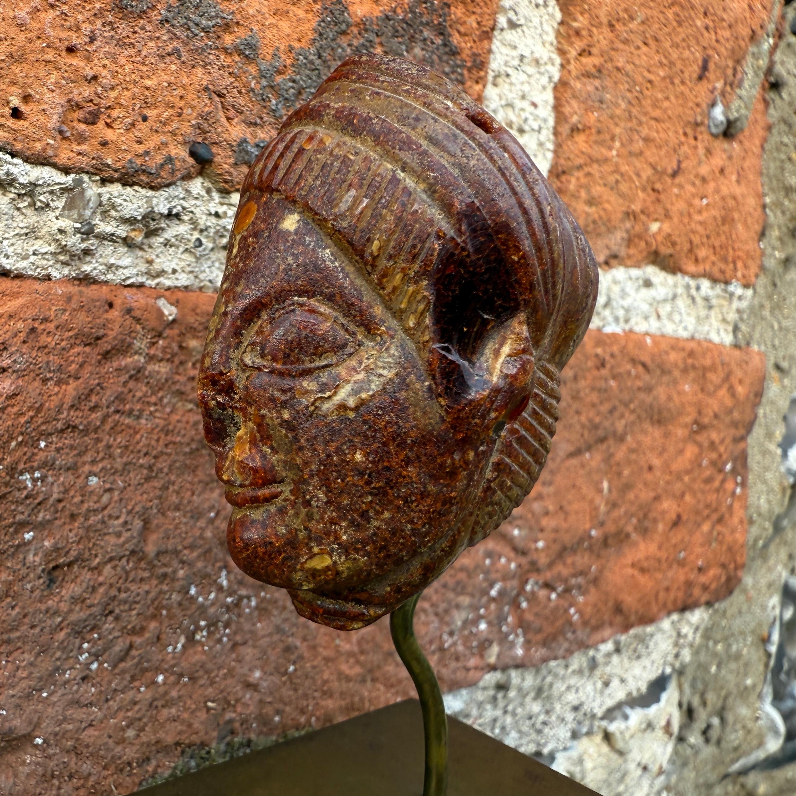 An Etruscan Amber Head Pendant. Etruria, circa 5th century B.C. For Sale 7