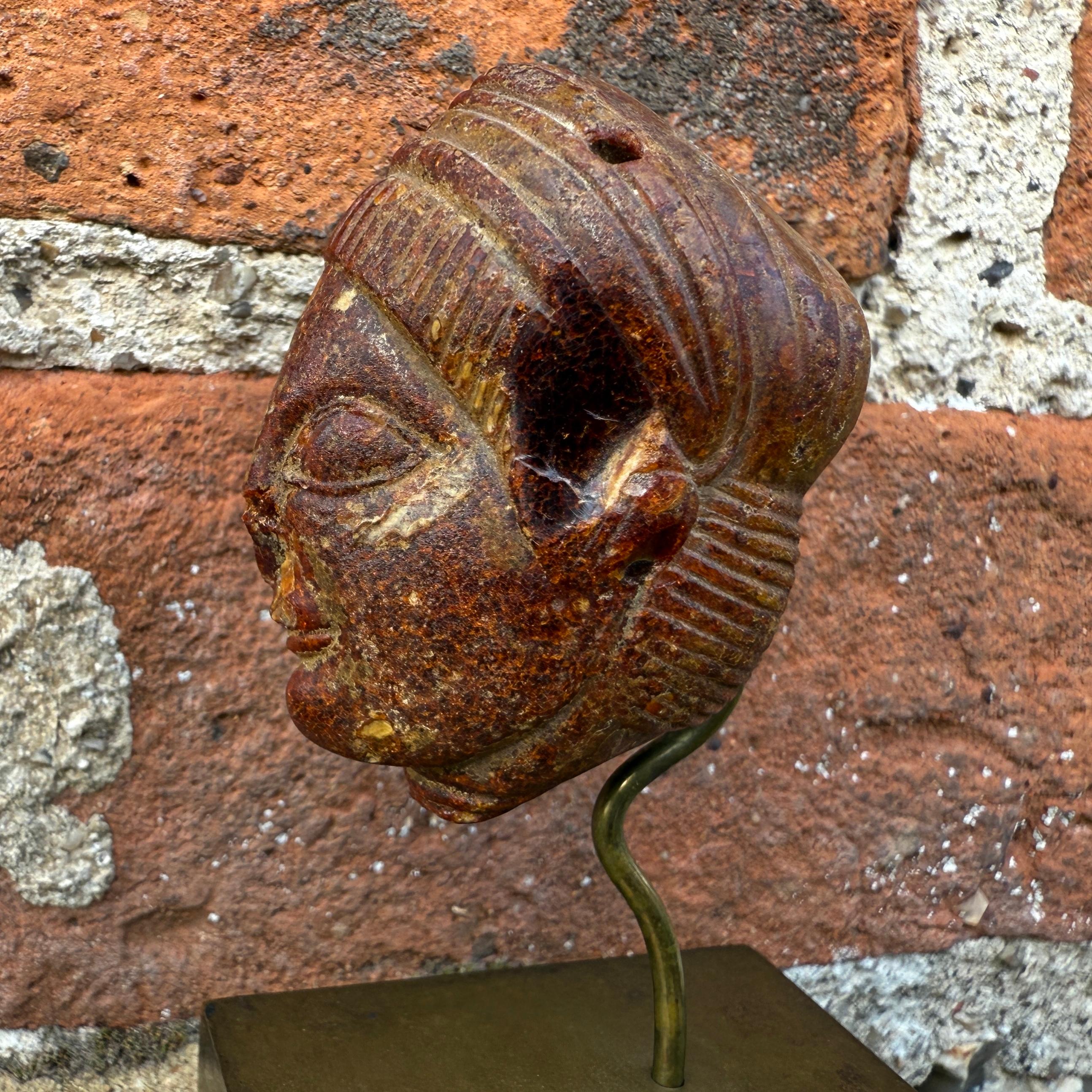 An Etruscan Amber Head Pendant. Etruria, circa 5th century B.C. For Sale 8