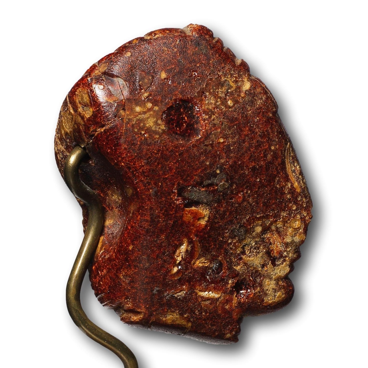 An Etruscan Amber Head Pendant. Etruria, circa 5th century B.C. For Sale 9