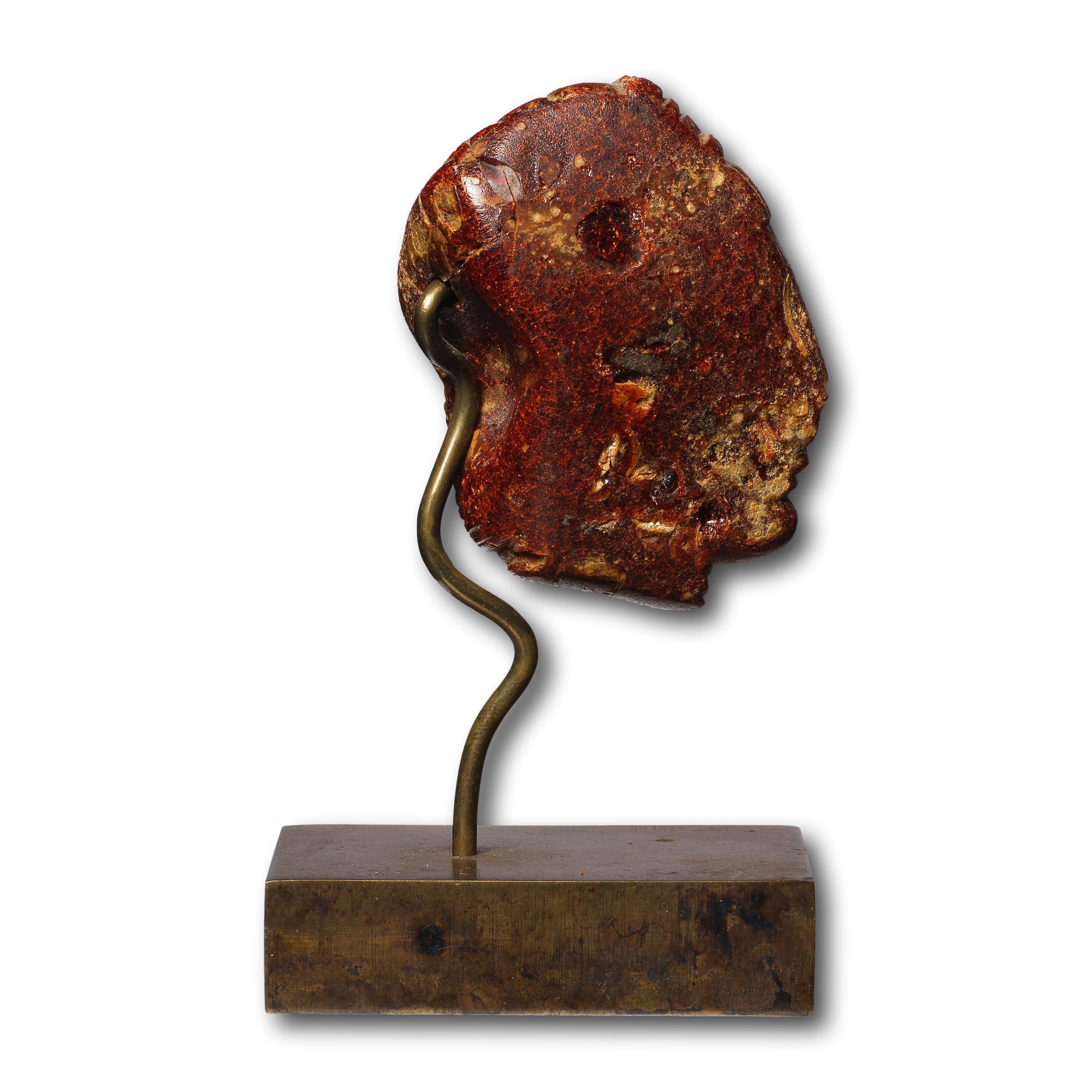 An Etruscan Amber Head Pendant. Etruria, circa 5th century B.C. For Sale 10