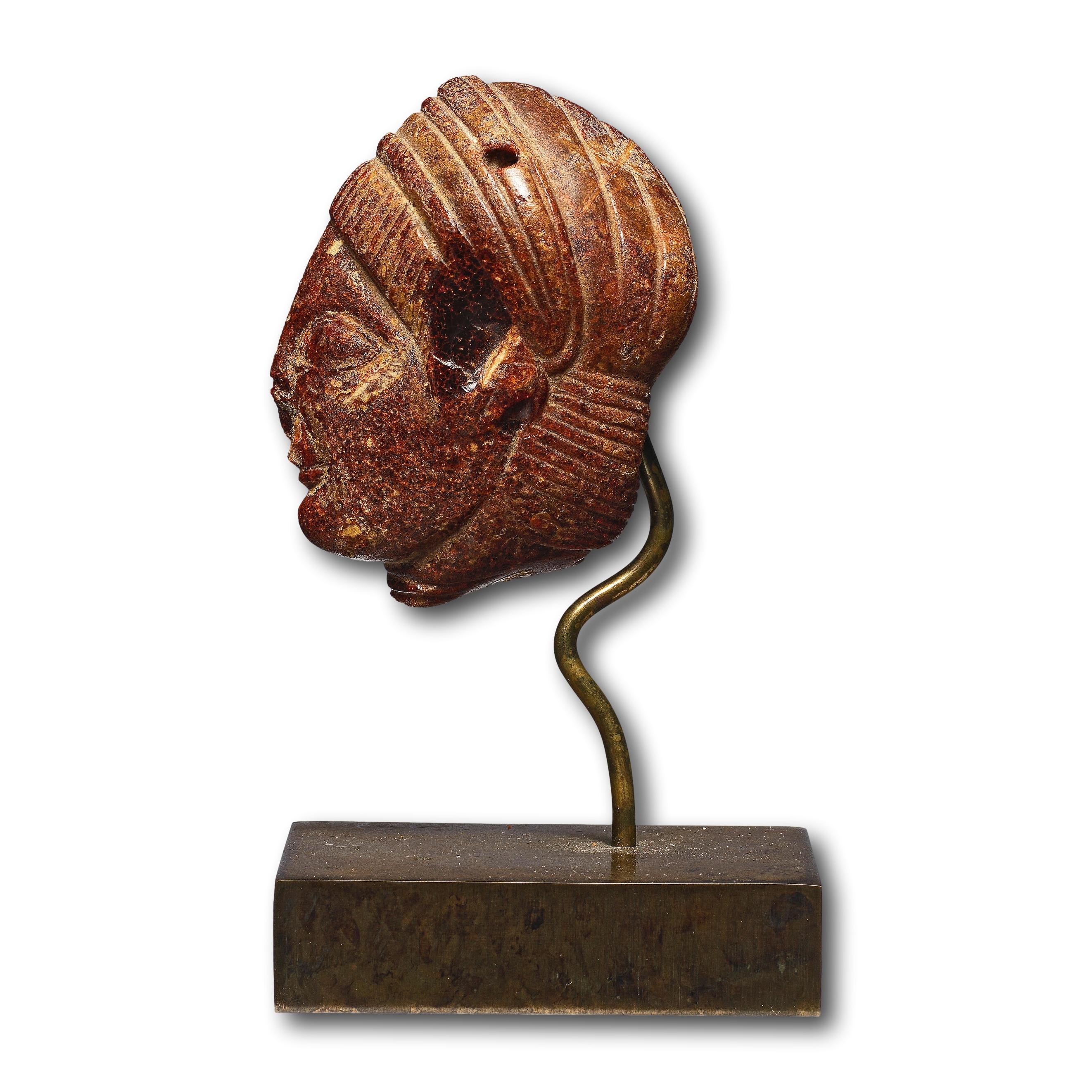 An Etruscan Amber Head Pendant. Etruria, circa 5th century B.C. For Sale 11