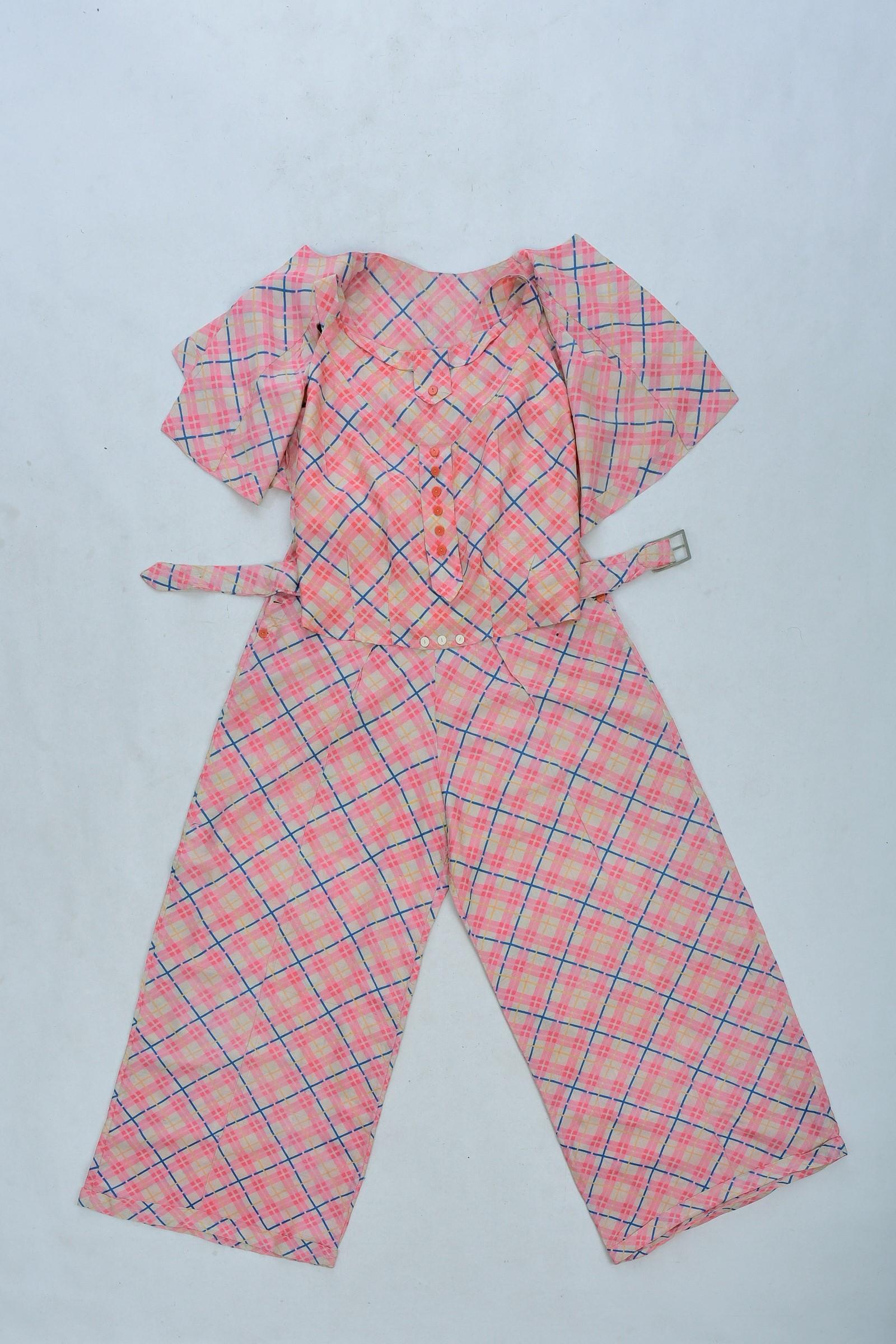 Circa 1935

France

Beautiful three-piece evening pajamas in printed wild silk dating from the 1930s. Beautiful pink and blue check print, ancestor of Vichy, on a very fine and supple raw silk allowing a refined and casual wear during beach parties