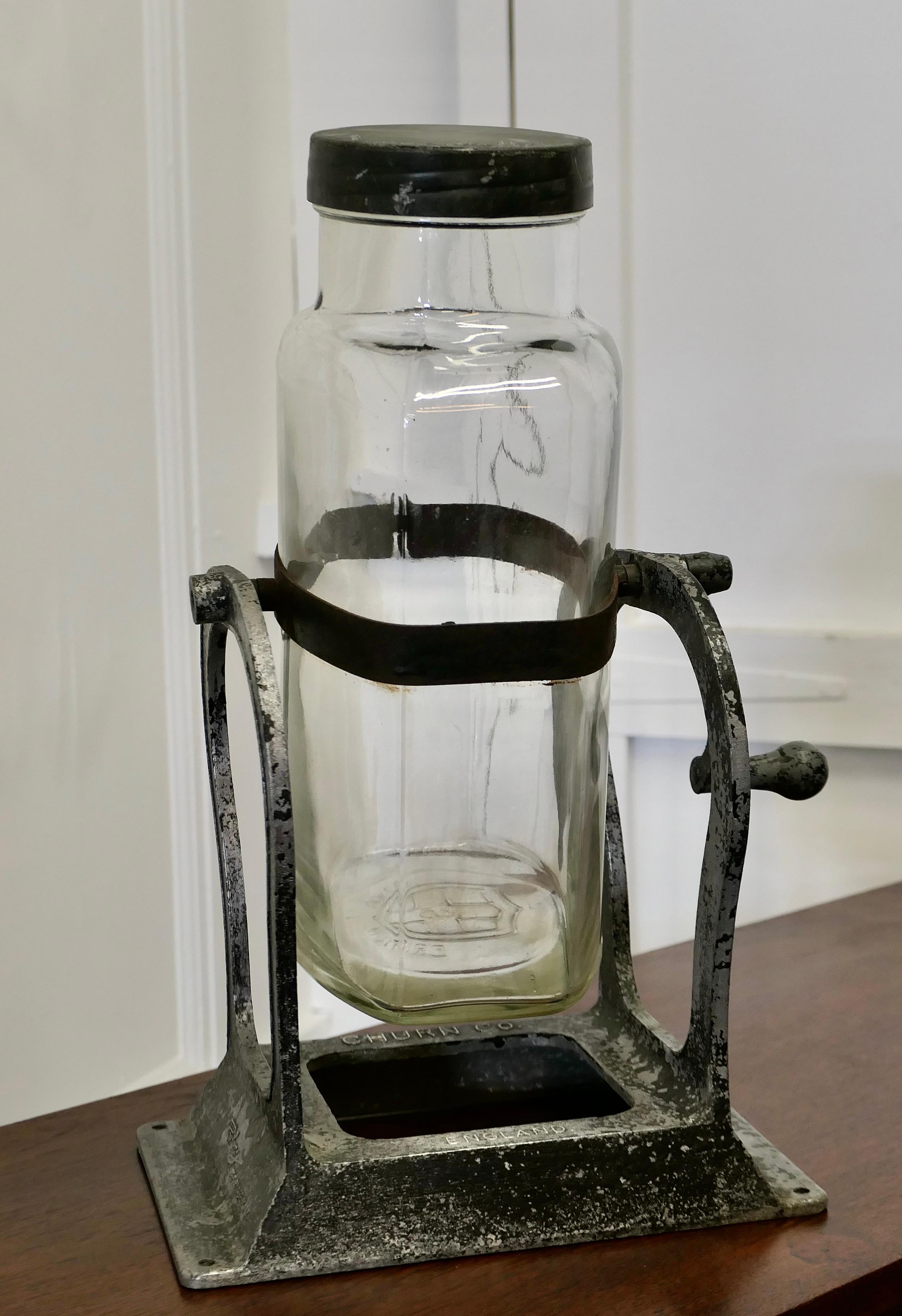 An Excellent Hand Driven Home Butter Churn 

The Churn has a cast metal frame stamped Rowbury Churn Co, the large glass jar is strapped in the centre and is connected to the winding handle , it all works perfectly well if a little primitive in