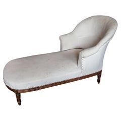 Un'eccellente chaise longue con bracci a voluta in noce Napoleone III