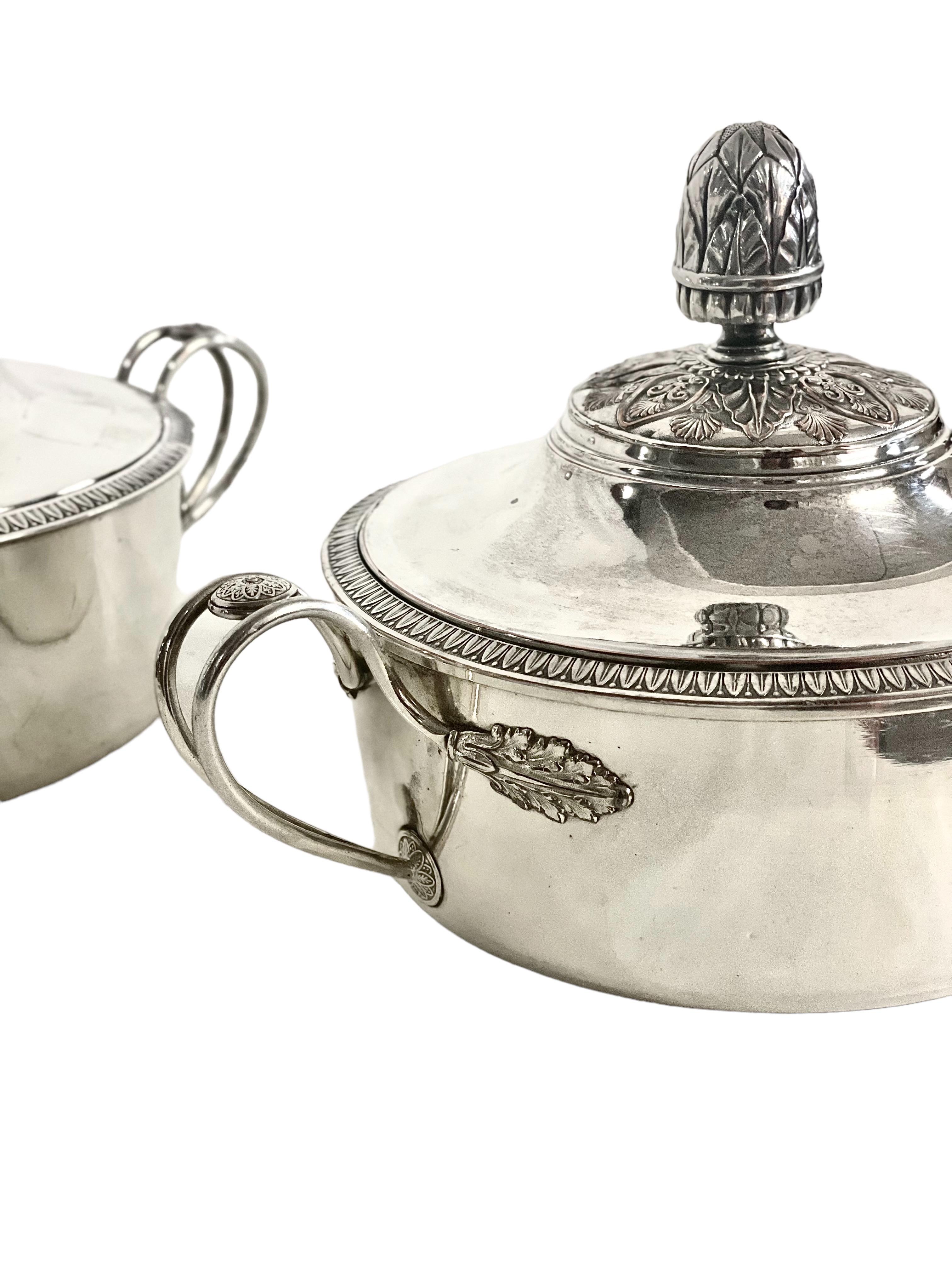 An excellent pair of antique silver-plated vegetable or soup tureens, circular in shape and with wonderful, ornamental side handles, which cling to the body of the dish in the form of extravagant acanthus fronds. 
The close-fitting lids are finely