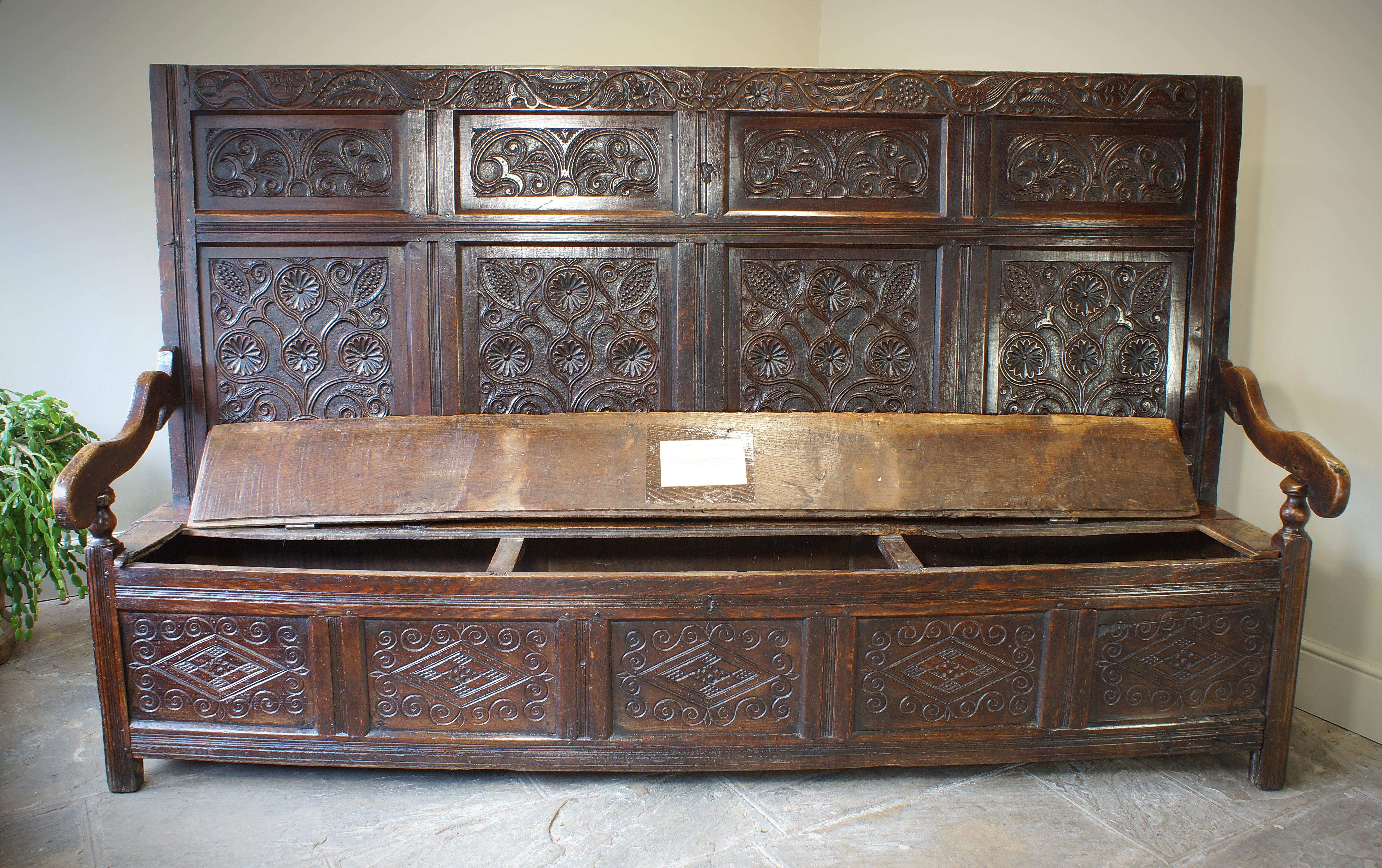 An Exceptional 17th Century English Oak Carved Box Settle. 10