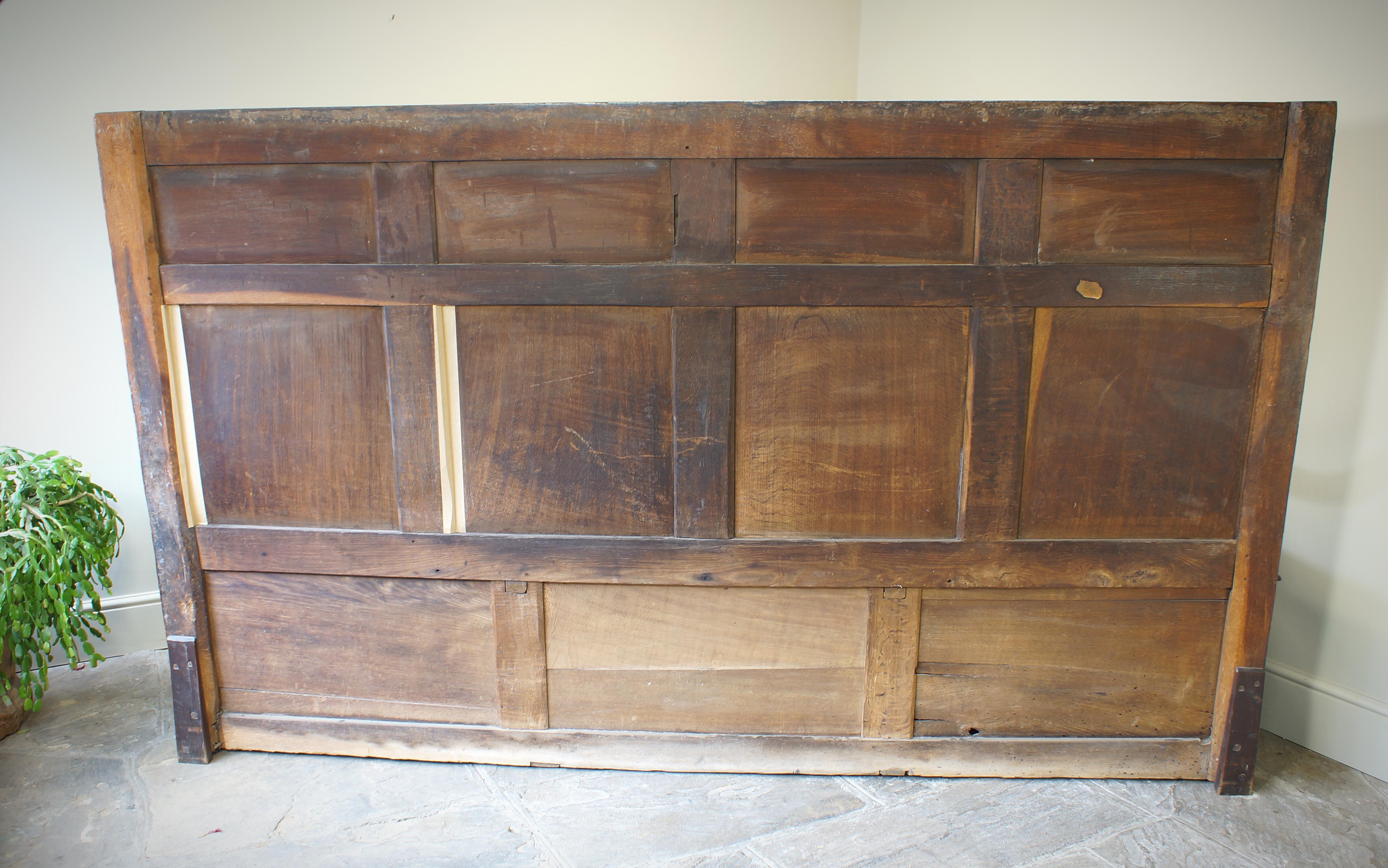 An Exceptional 17th Century English Oak Carved Box Settle. 12