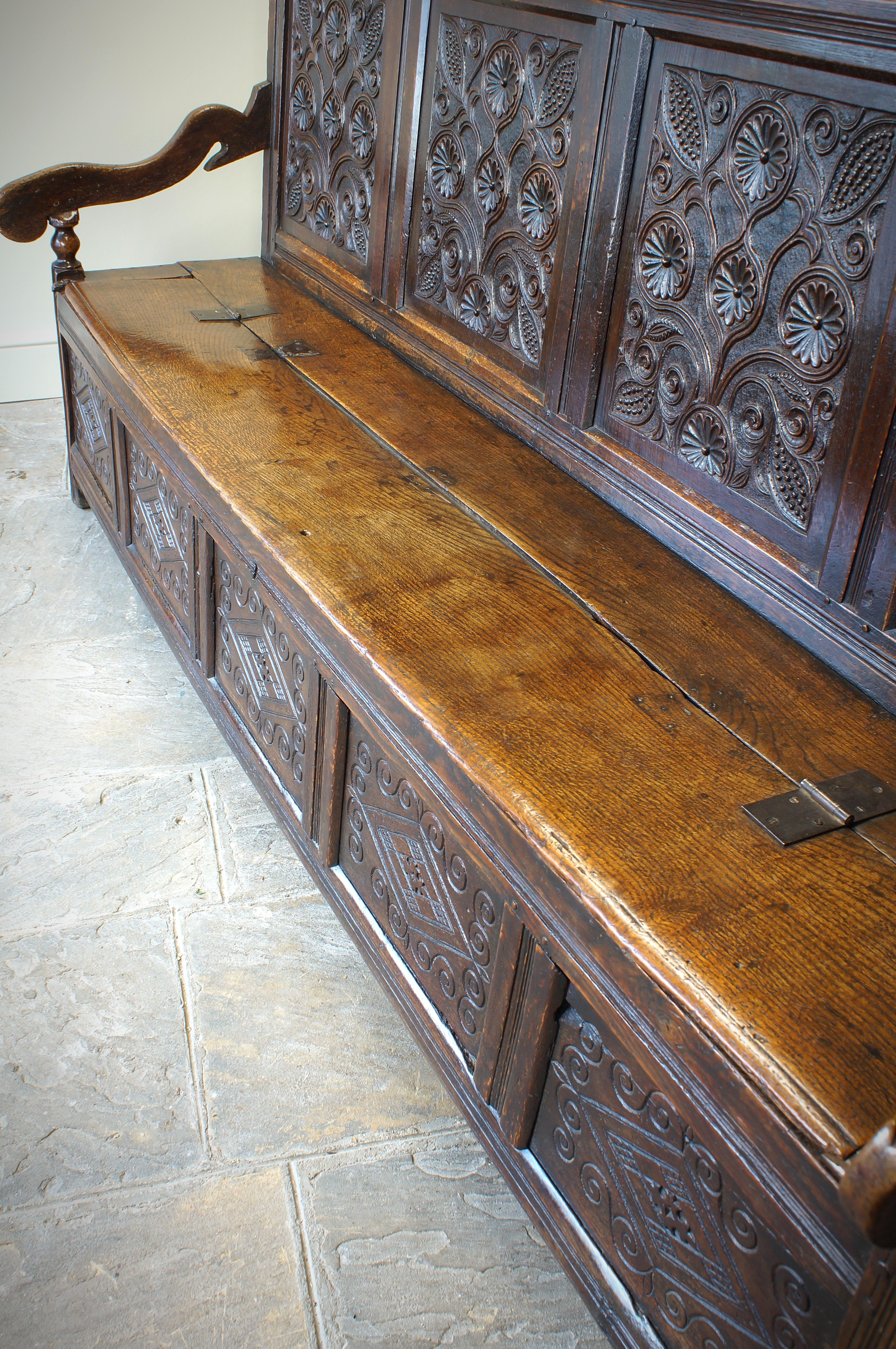An Exceptional 17th Century English Oak Carved Box Settle. 13