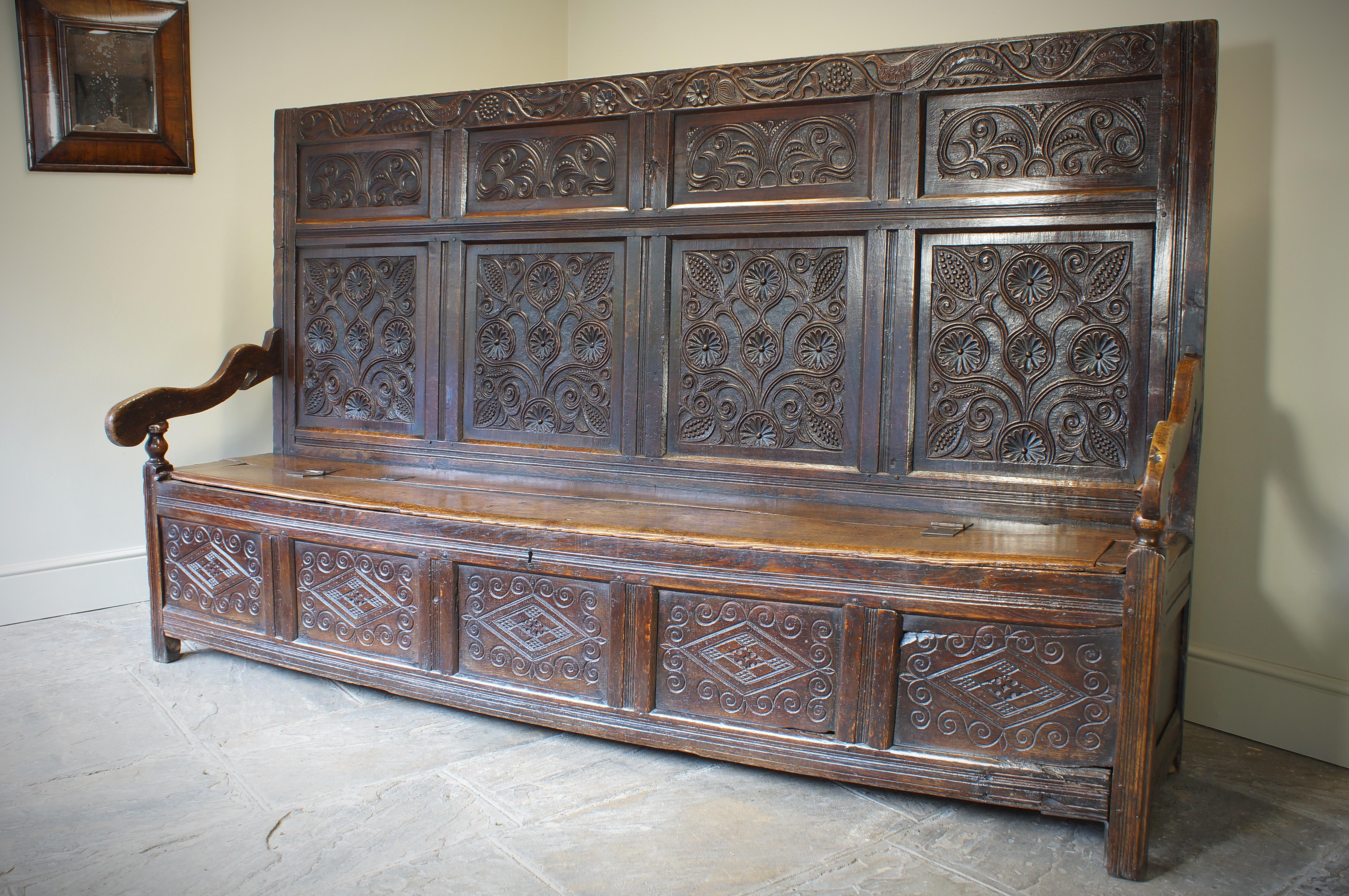 Hand-Carved An Exceptional 17th Century English Oak Carved Box Settle.