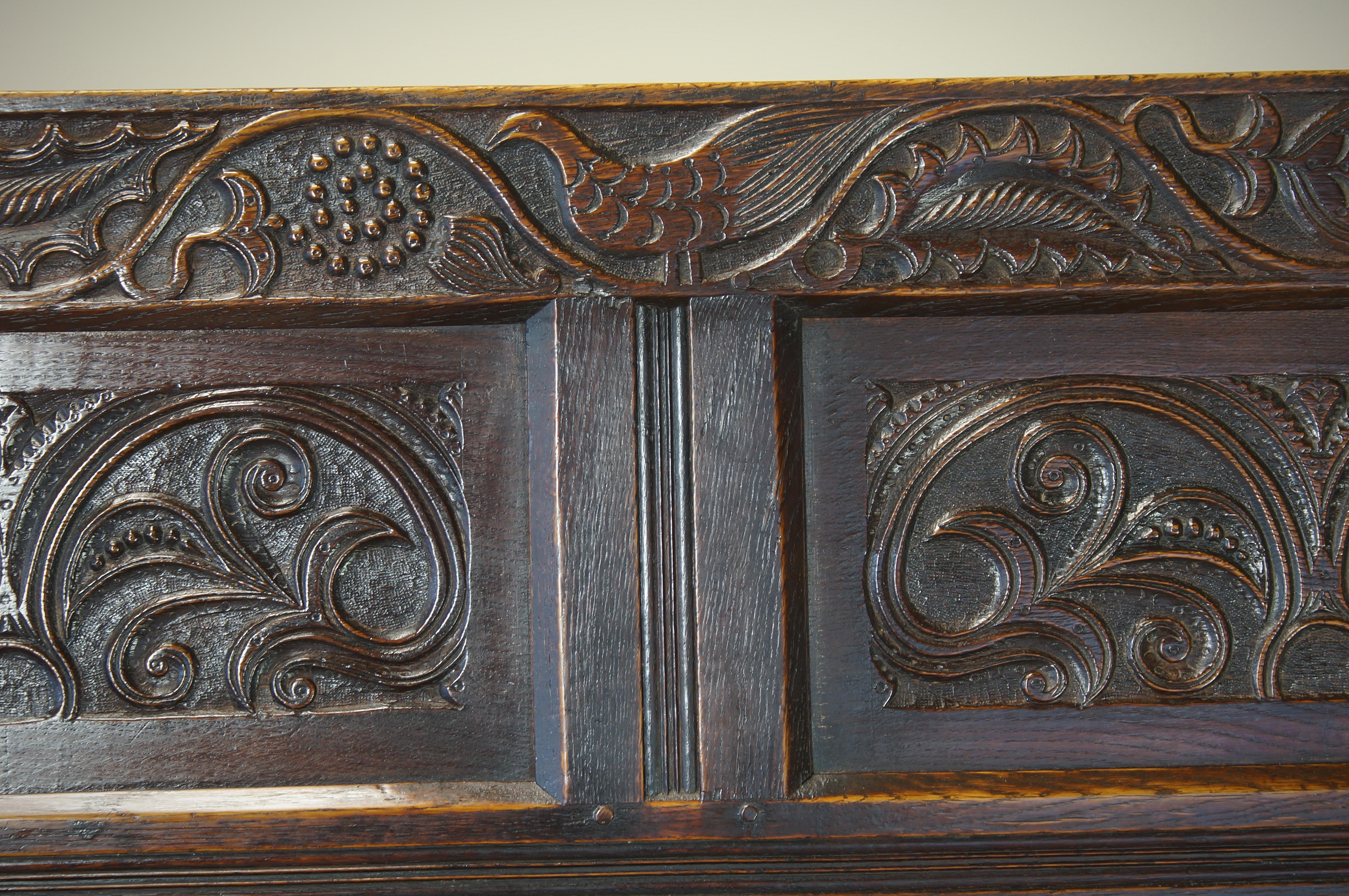 An Exceptional 17th Century English Oak Carved Box Settle. 1