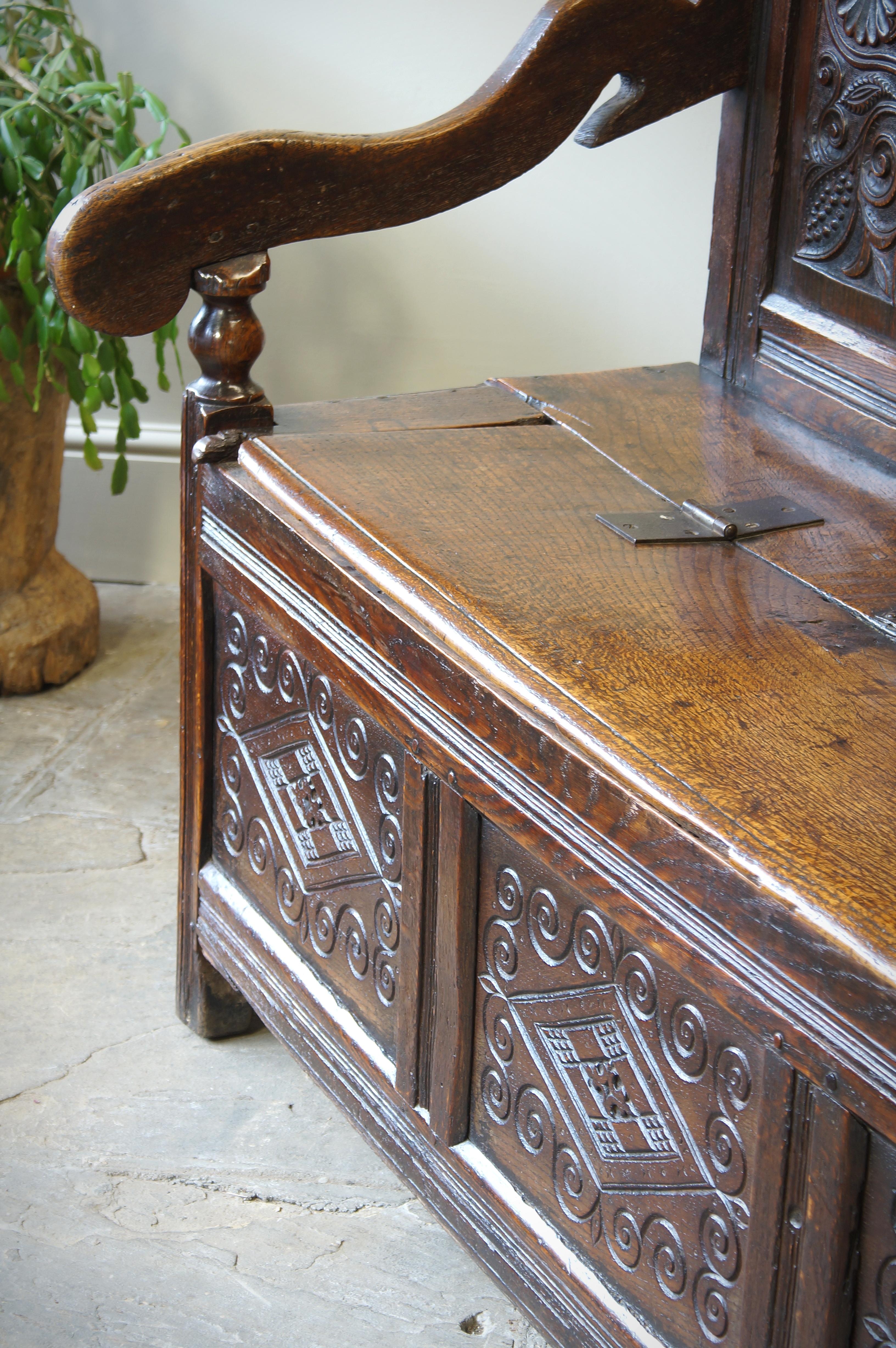 An Exceptional 17th Century English Oak Carved Box Settle. 2