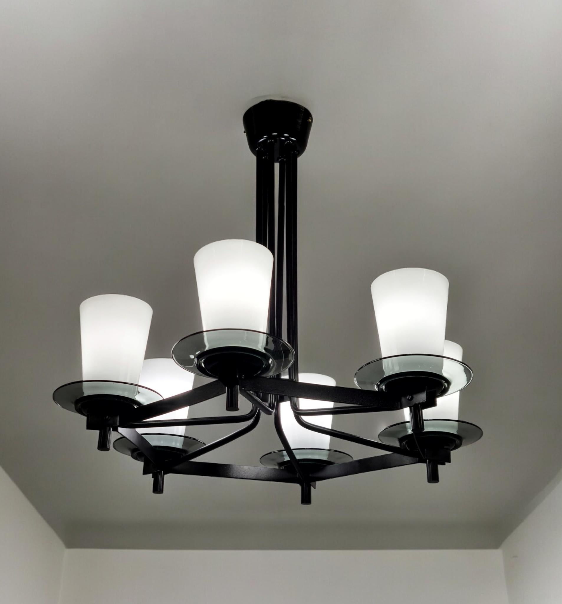 A stunning and Mid-Century Modern ceiling lamp model K1-88 by Maria Lindemann for Idman. This sleek lamp is a rare piece that we have never had before. The Idman catalogue has it marked as (not produced any more) at one point which might explain the