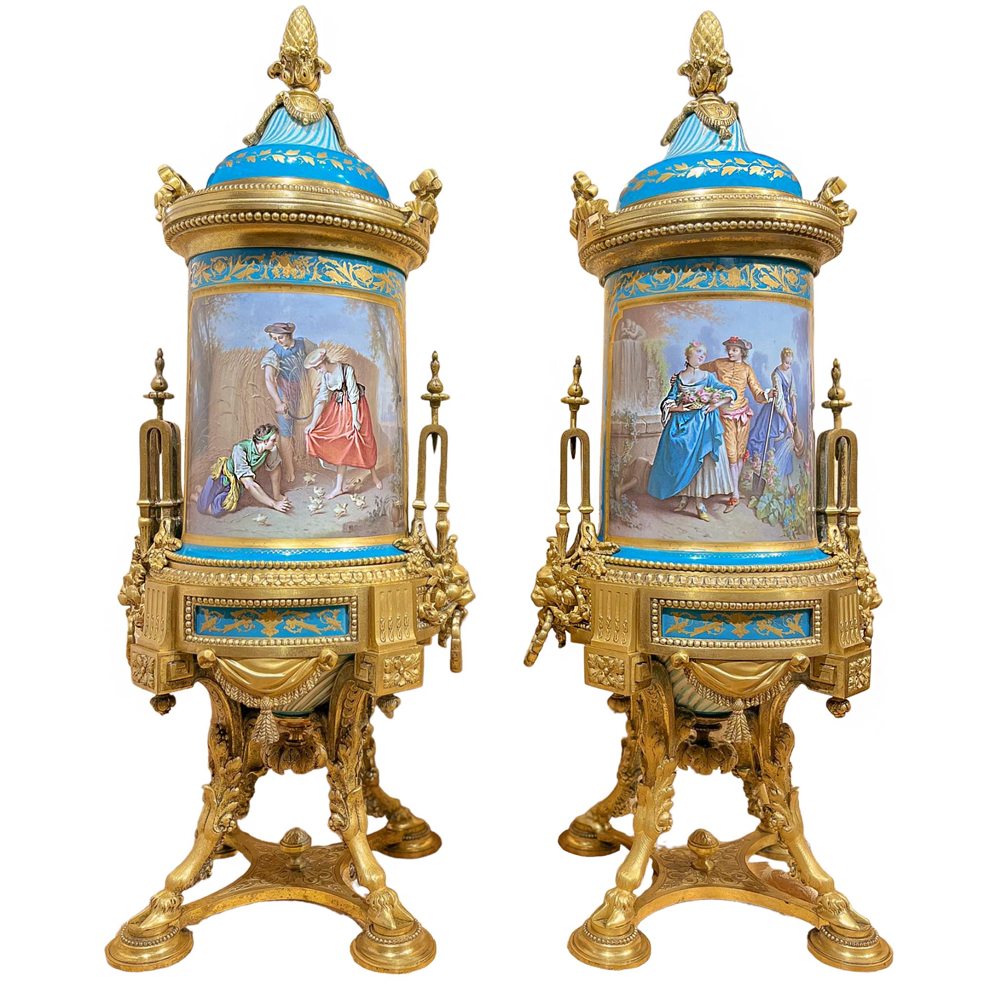 Double sided porcelain urns with genre scenes and still life paintings on their reverse. The piece demonstrates the technical excellence of Sèvres porcelain, with delicate gold leaf in the form of foliage and garlands applied to the porcelain