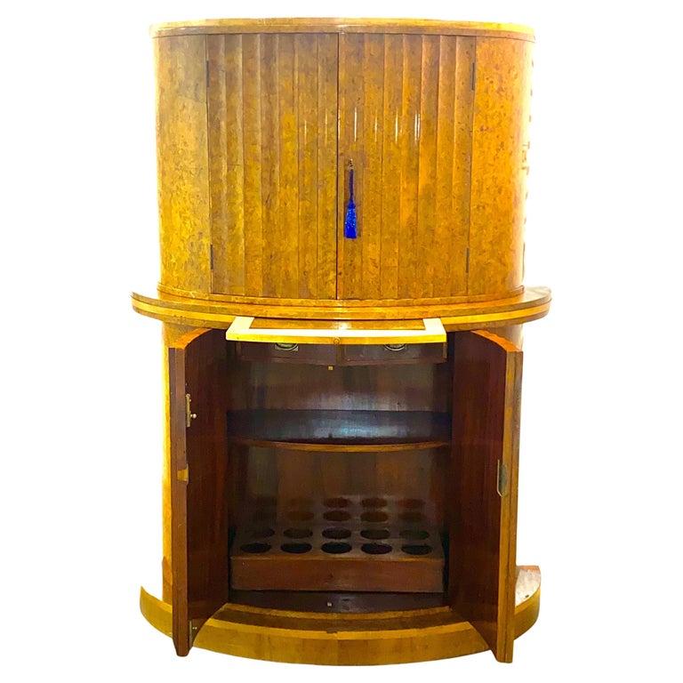 I can confidently say this is the only Epstein Fluted cocktail cabinet on the market today, they are almost extinct. Please look around and you will not find another one like this of Semi Circular form with Fluted doors in blonde wood veneer. This