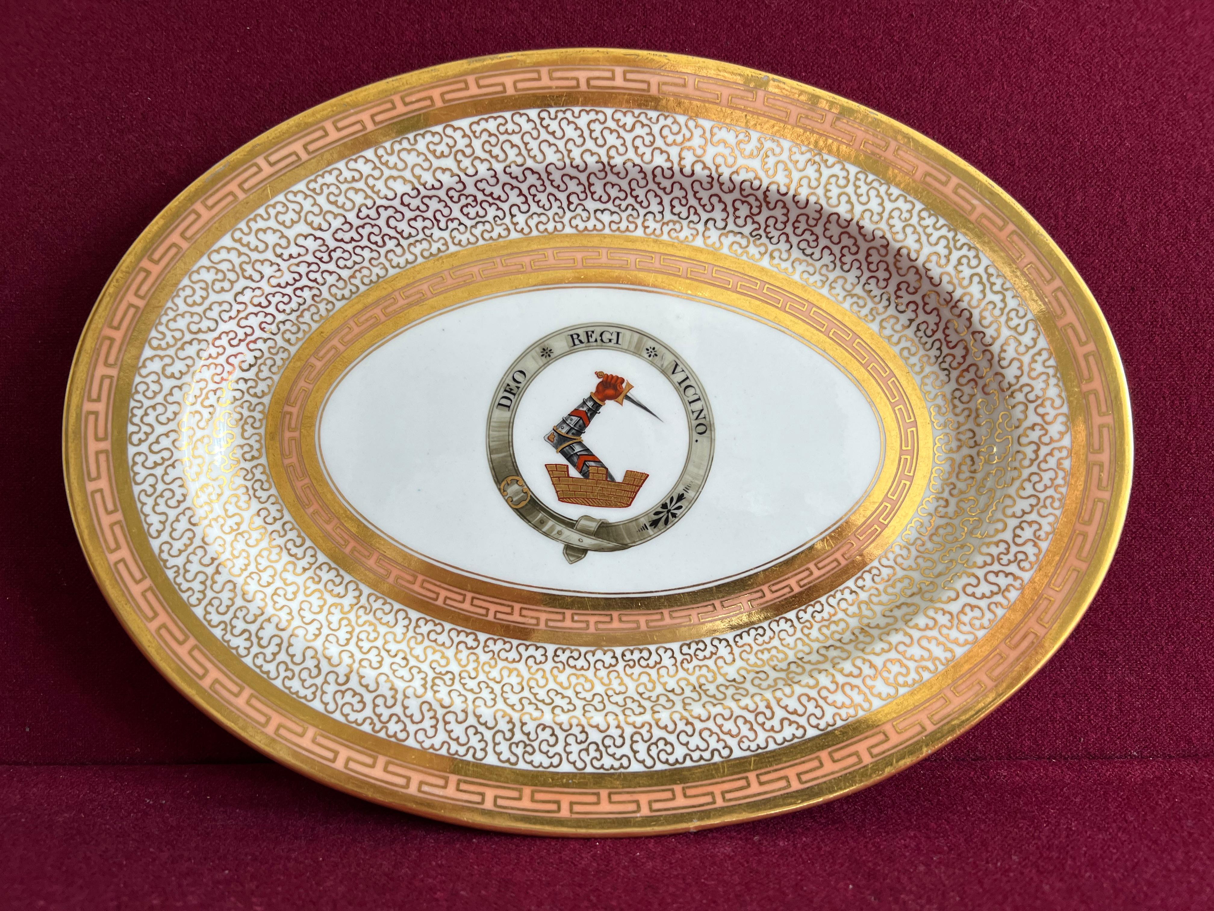 An exceptional Barr Flight Barr Worcester porcelain platter c.1804-1813 made for the Cookesfamily of Bentley, Worcestershire, Hand Painted with their family crest and motto, DEO REGI VINCINO (To God, my King, my neighbour).  This oval platter is