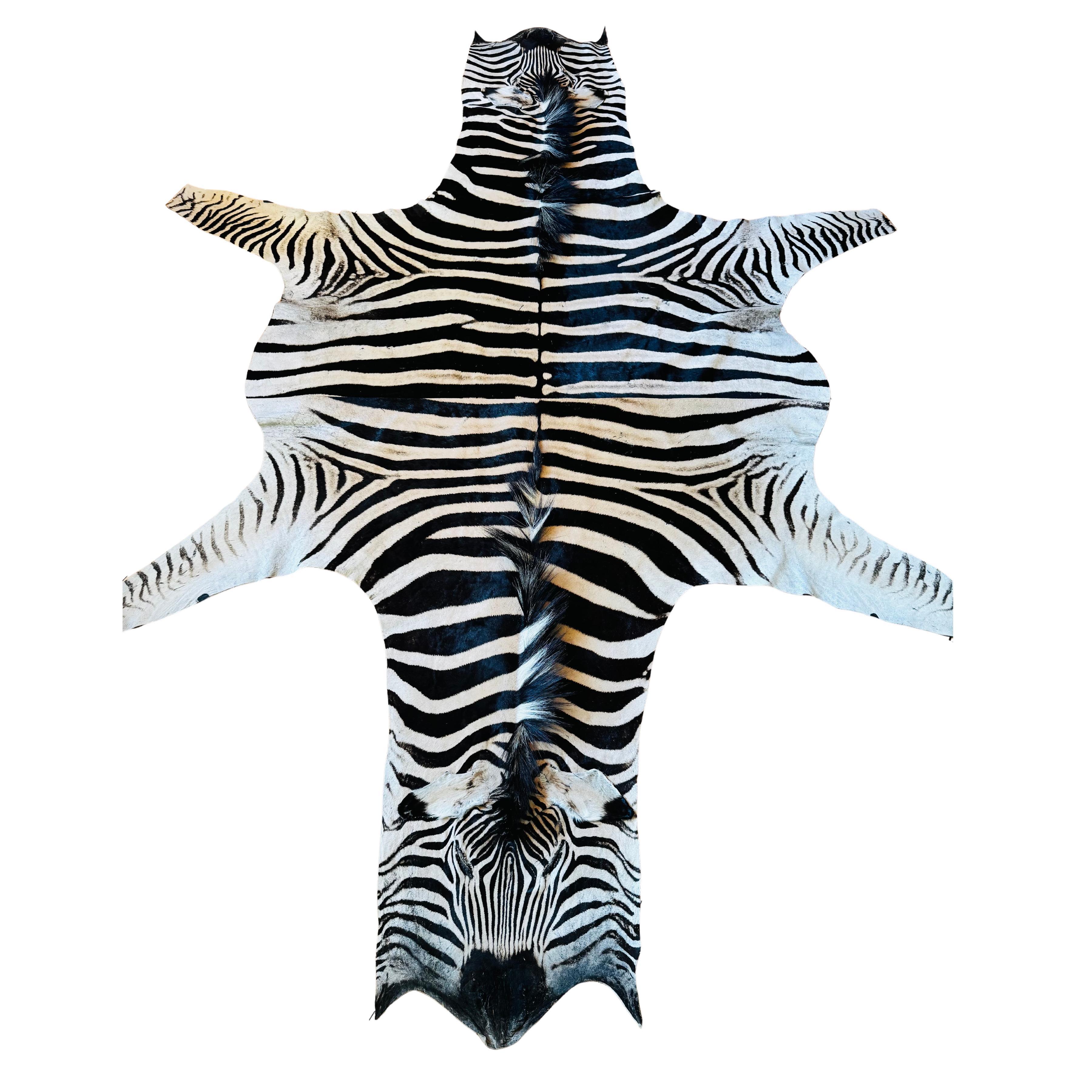 An exceptional Burchell zebra rug crafted from two unused hides.