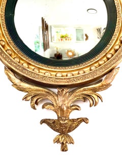 Miroir convexe en bois doré d'époque Régence