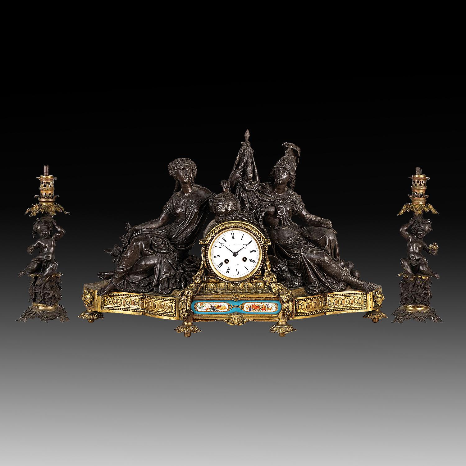 An Exceptional Very Fine French Mid-19th Century Triptych Gilt Bronze Sculptured Figural Empire Mantle Clock with Two Cherub Oil Lamps

This is an extraordinary and exceptional piece of finely sculptured gilt bronze and antimony three-piece
