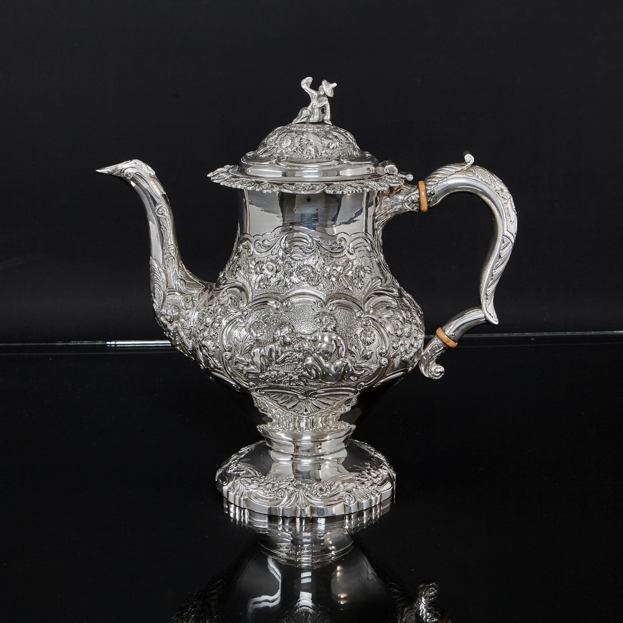 Superb and impressive 5-piece silver tea and coffee service in the rococo style made during the reign of George IV. The elaborate, highly decorative chasing around the bodies depicts the typical exuberant decorations of the period, incorporating