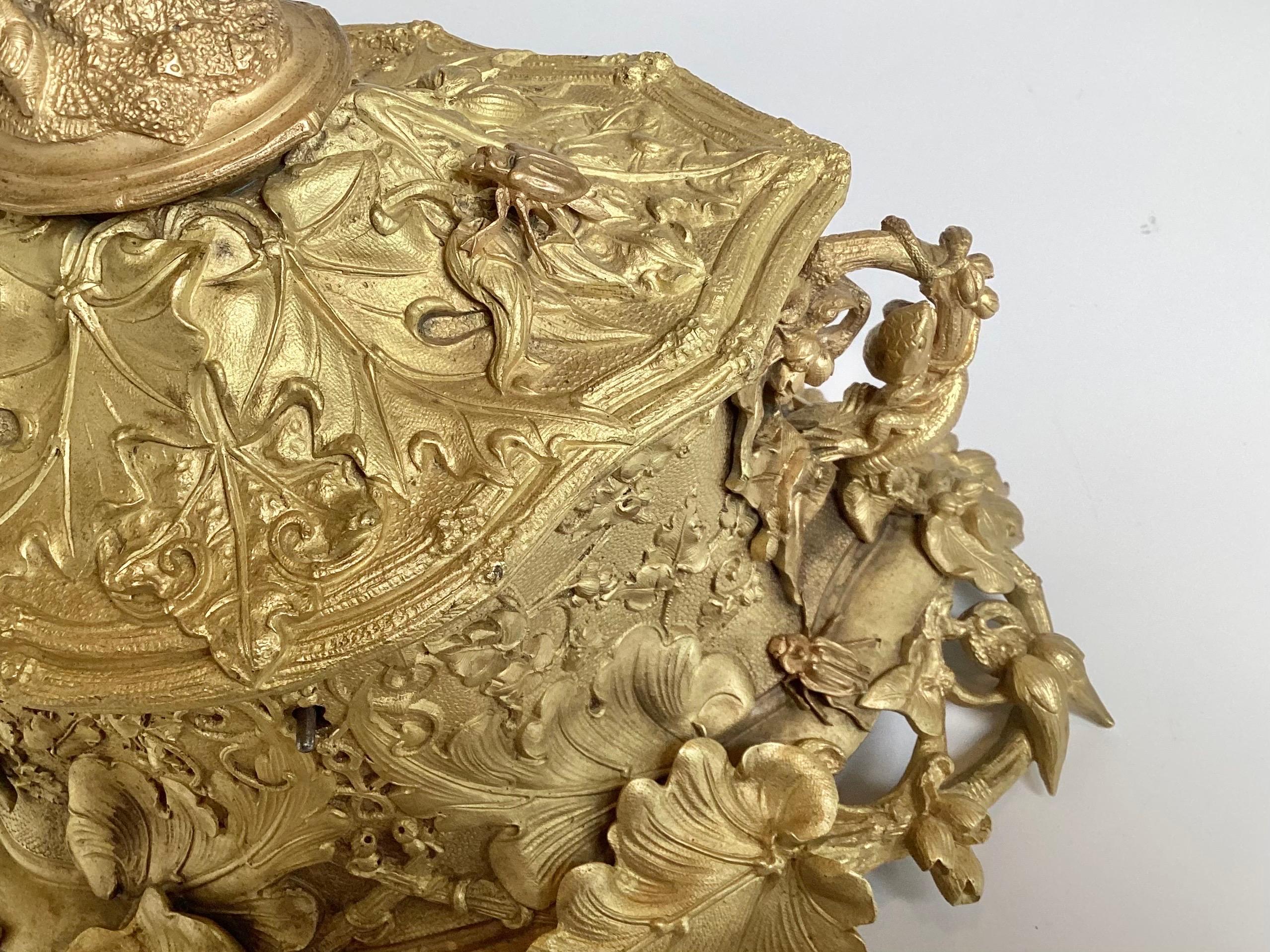 An exceptional gilt bronze jewelry casket, attributed to Le Blanc, France Circa 1875.  Remarkable craftmanship decorated with squirrels and lizard on handles with beetles and nesting birds entwined with all over heavy foliage design .  9.5 inches