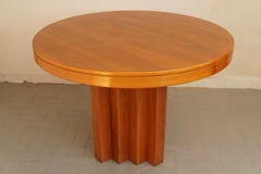 An exceptional Italian brutalist dining table in solid oak