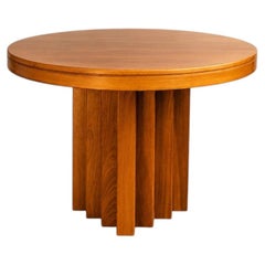 An exceptional Italian brutalist dining table in solid oak