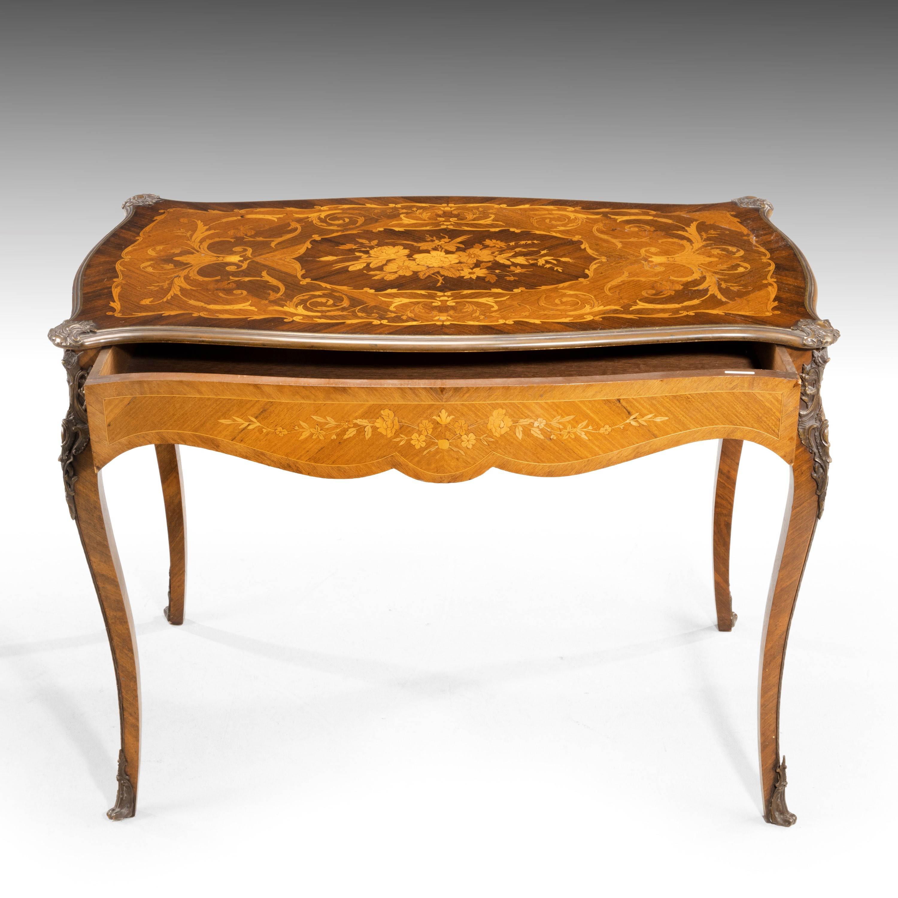 A quite exceptional Kingwood, rosewood and exotically timbered centre table. Retaining all of its original gilt bronze mounts and sabots, now oxidised to a rich deep bronze color. Quite outstanding calibre marquetry top of foliage and flowers. The